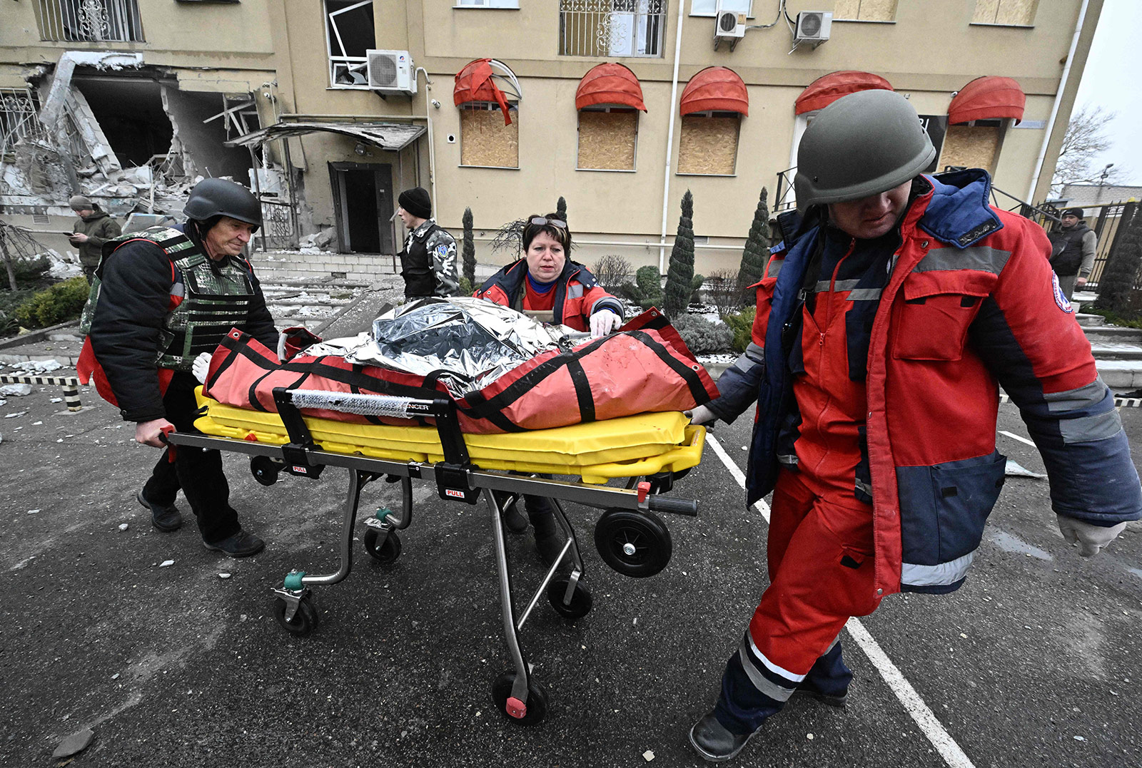 Medics transport the body of a resident killed after Russian shelling in Kherson, Ukraine, on Sunday, January 29. 