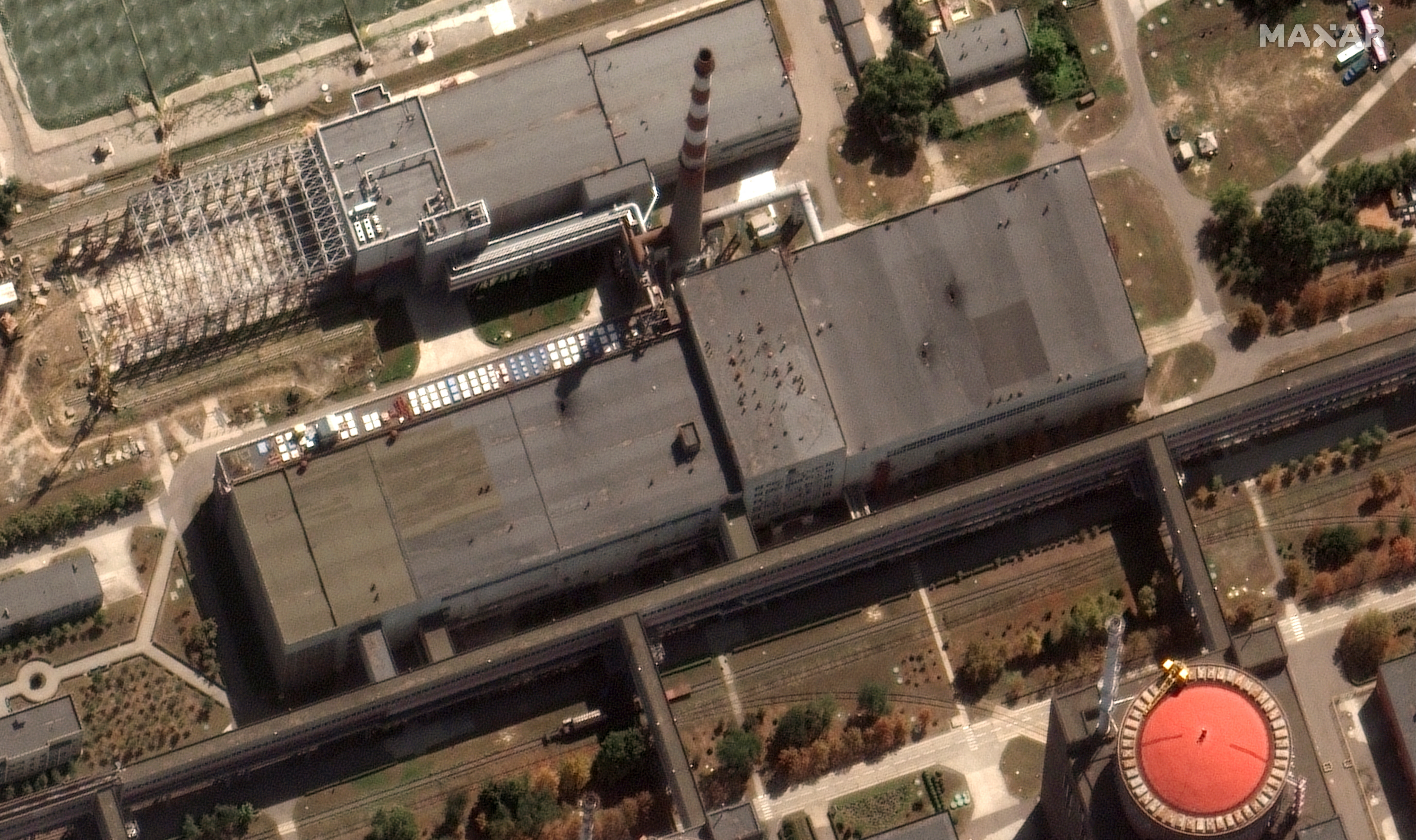 A satellite image showing holes in the roof of Zaporizhzhia nuclear power plant on August 29.