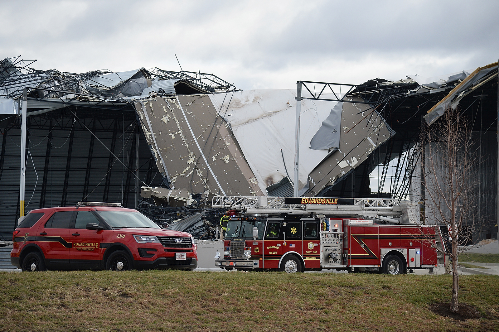 First responders surround a damaged Amazon Distribution Center on December 11, in Edwardsville, Illinois. (Michael B. Thomas/Getty Images)