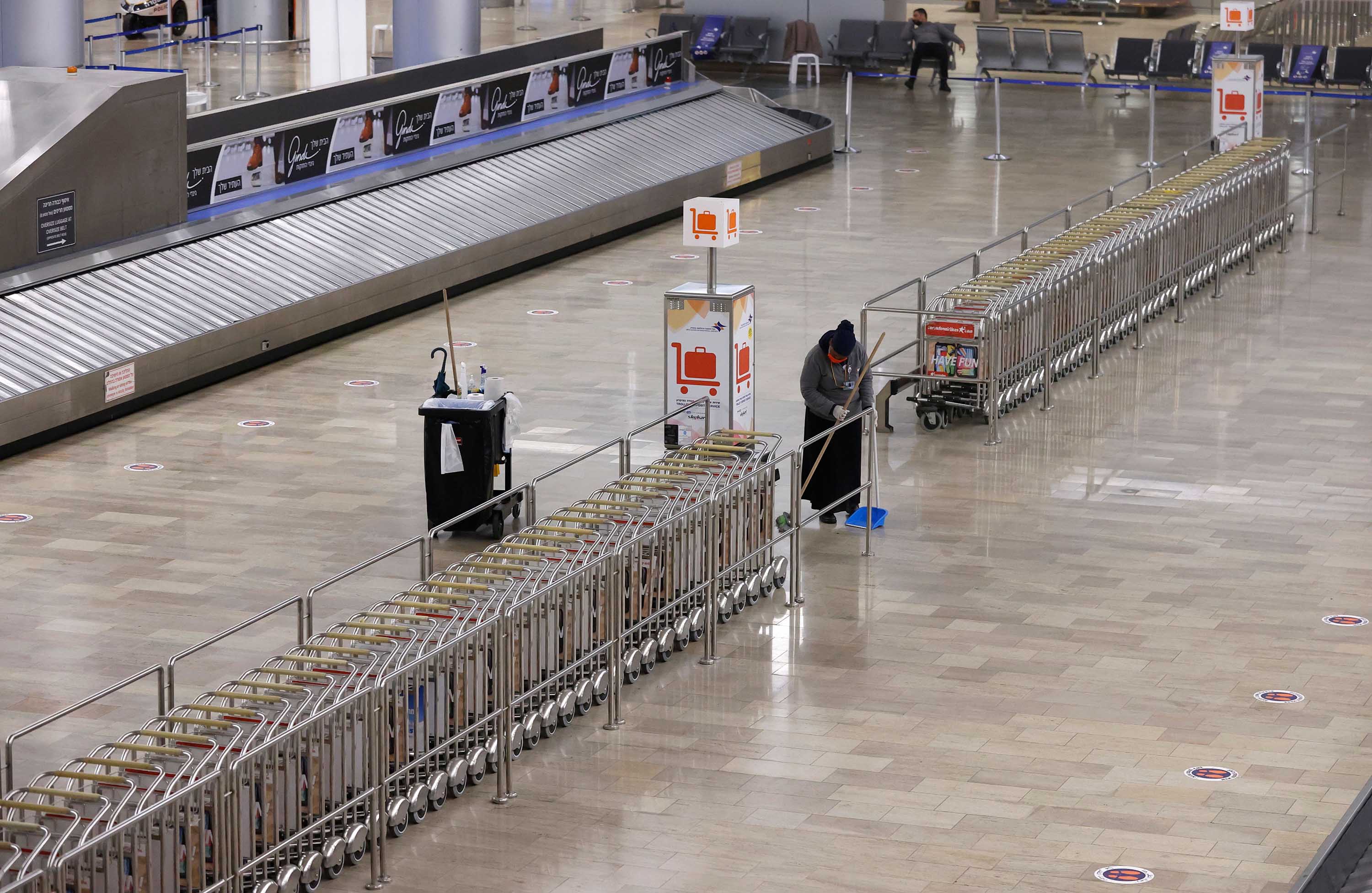 A cleaner works in a deserted Ben-Gurion Airport near Tel Aviv, Israel, on March 1, ahead of the partial re-opening of borders.