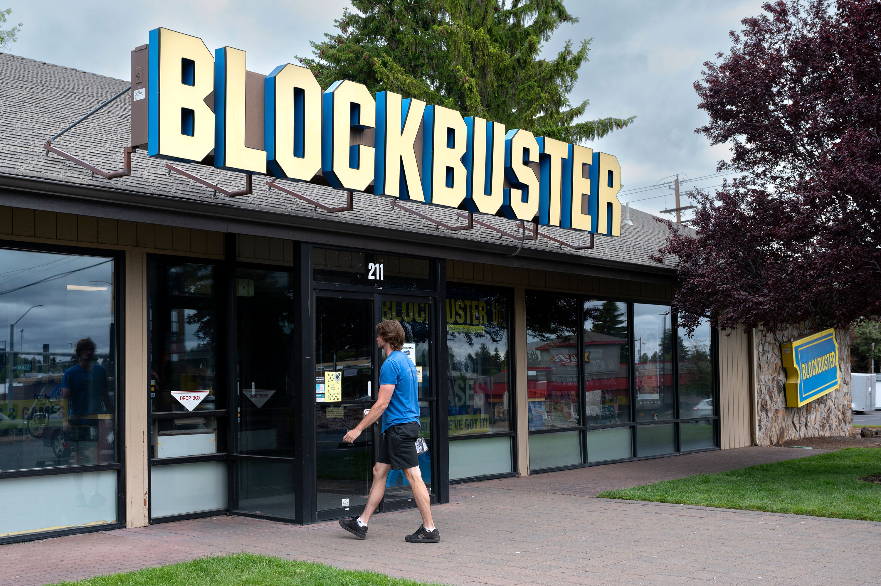 A man returns rented DVDs to the last remaining Blockbuster in Bend, Oregon, in June 2022.