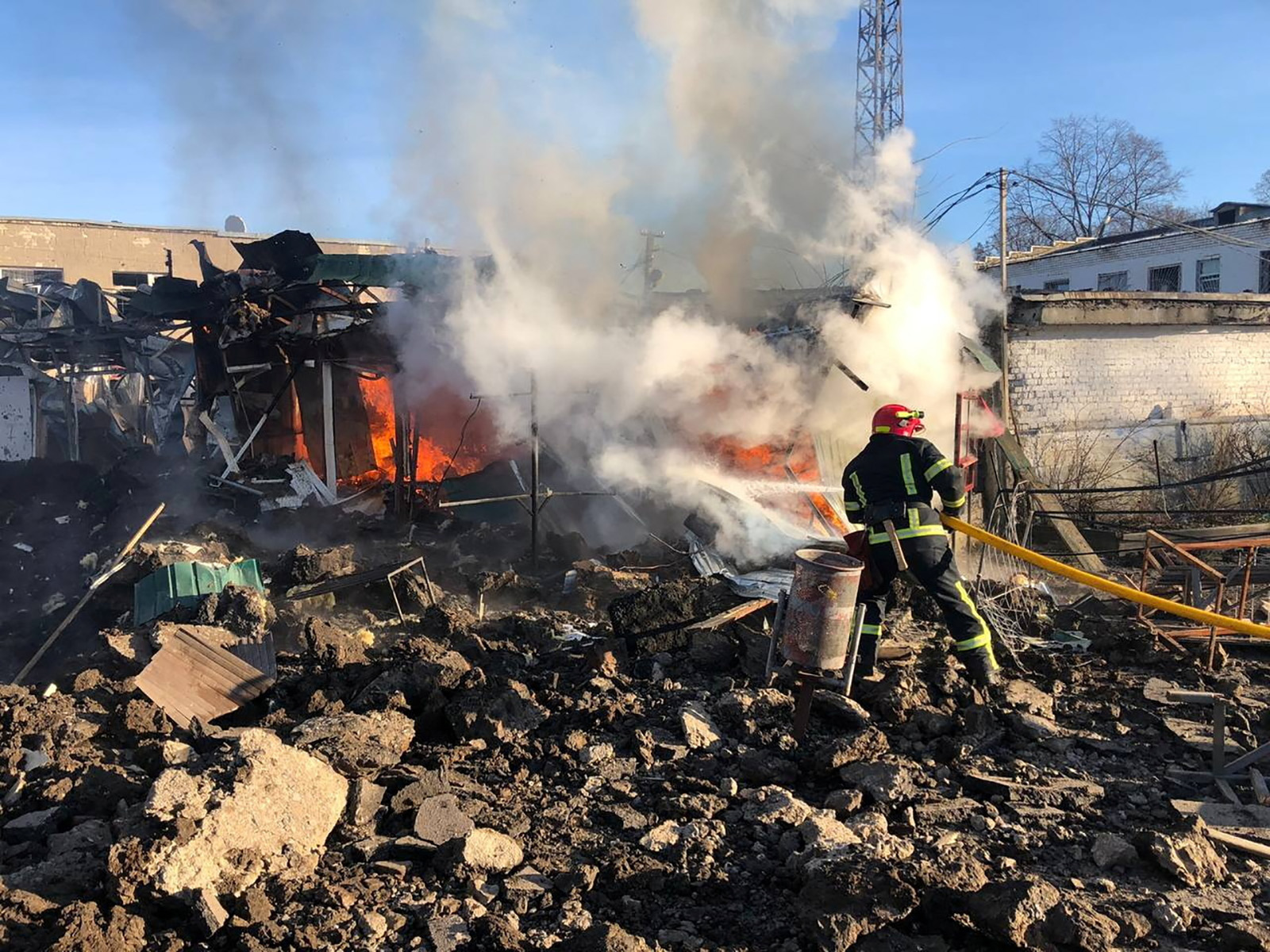 A firefighter works at a site of a market hit by Russian missiles in the town of Shevchenkove, Kharkiv region, Ukraine, on January 9.