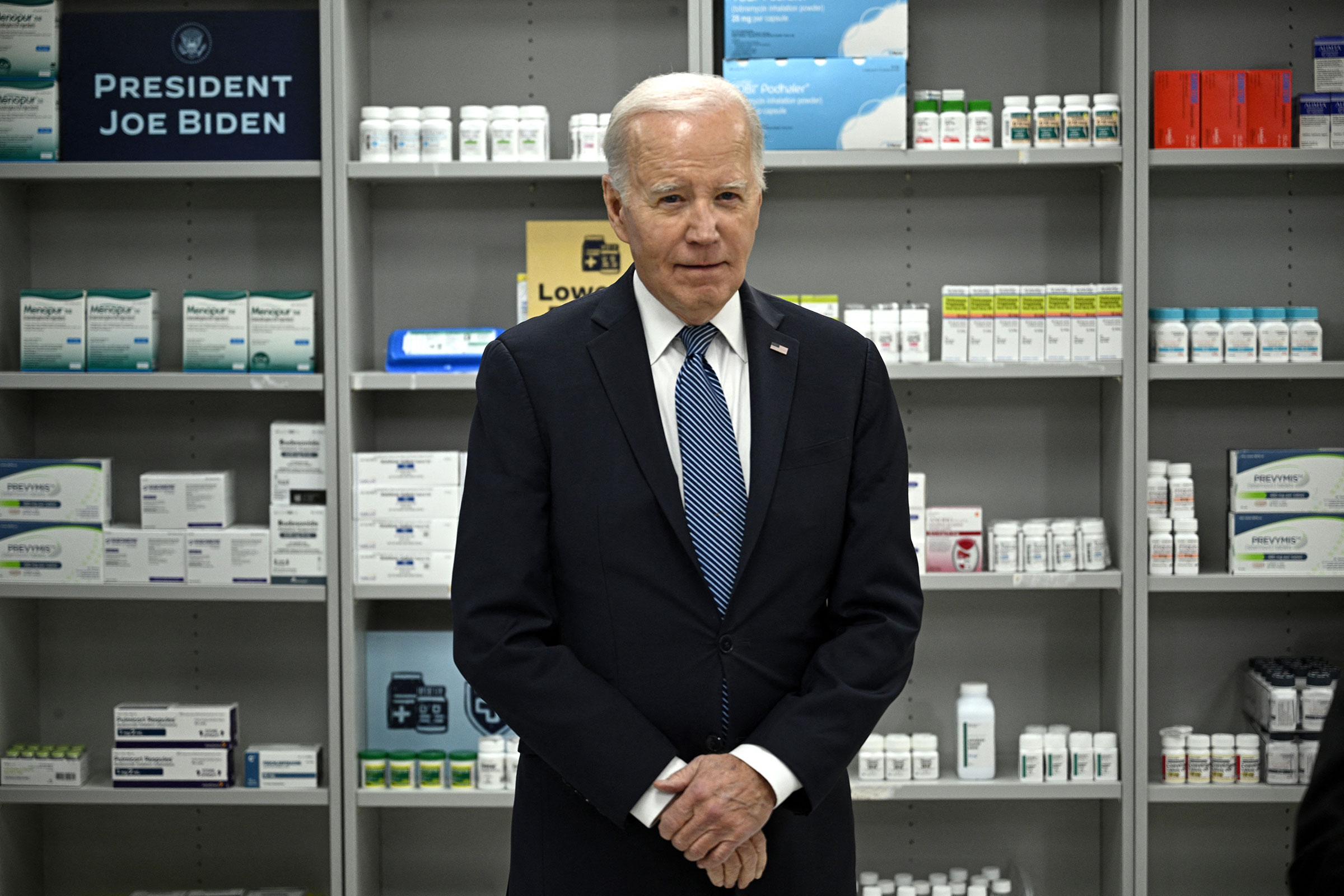 President Joe Biden listens as David Mitchell, not pictured, speaks about lowering prescription drug costs at the National Institutes of Health in Bethesda, Maryland, on December 14, 2023. 