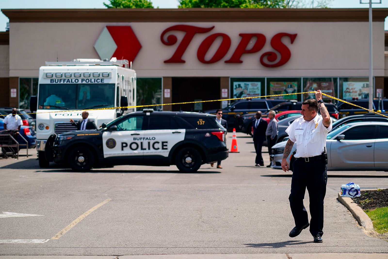 Police secure the scene of a shooting at Tops supermarket in Buffalo, New York, on May 15. 