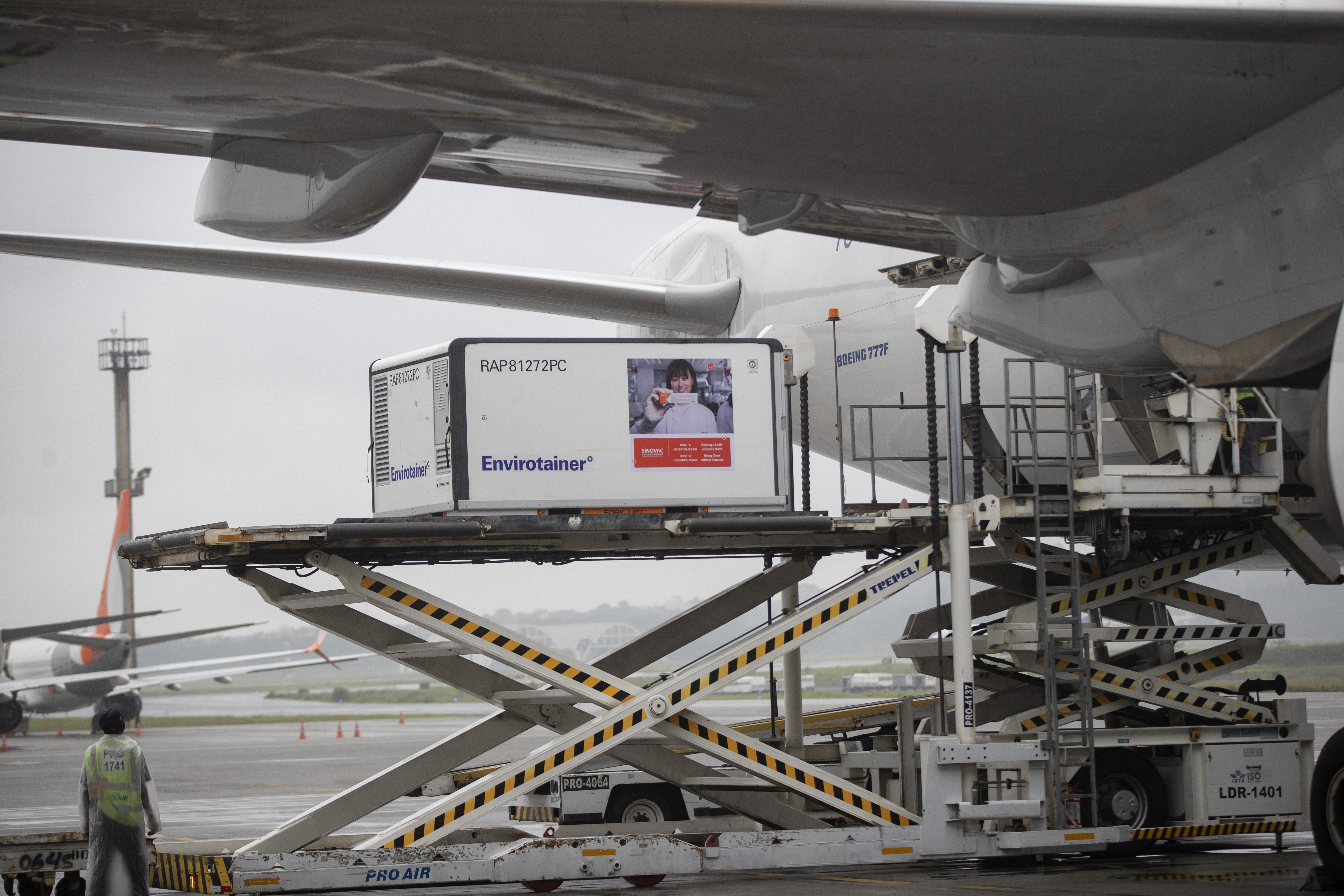 A container carrying the experimental COVID-19 vaccine CoronaVac is unloaded from a cargo plane that arrived from China at Guarulhos International Airport in Guarulhos, near Sao Paulo, Brazil, on Thursday, November 19.