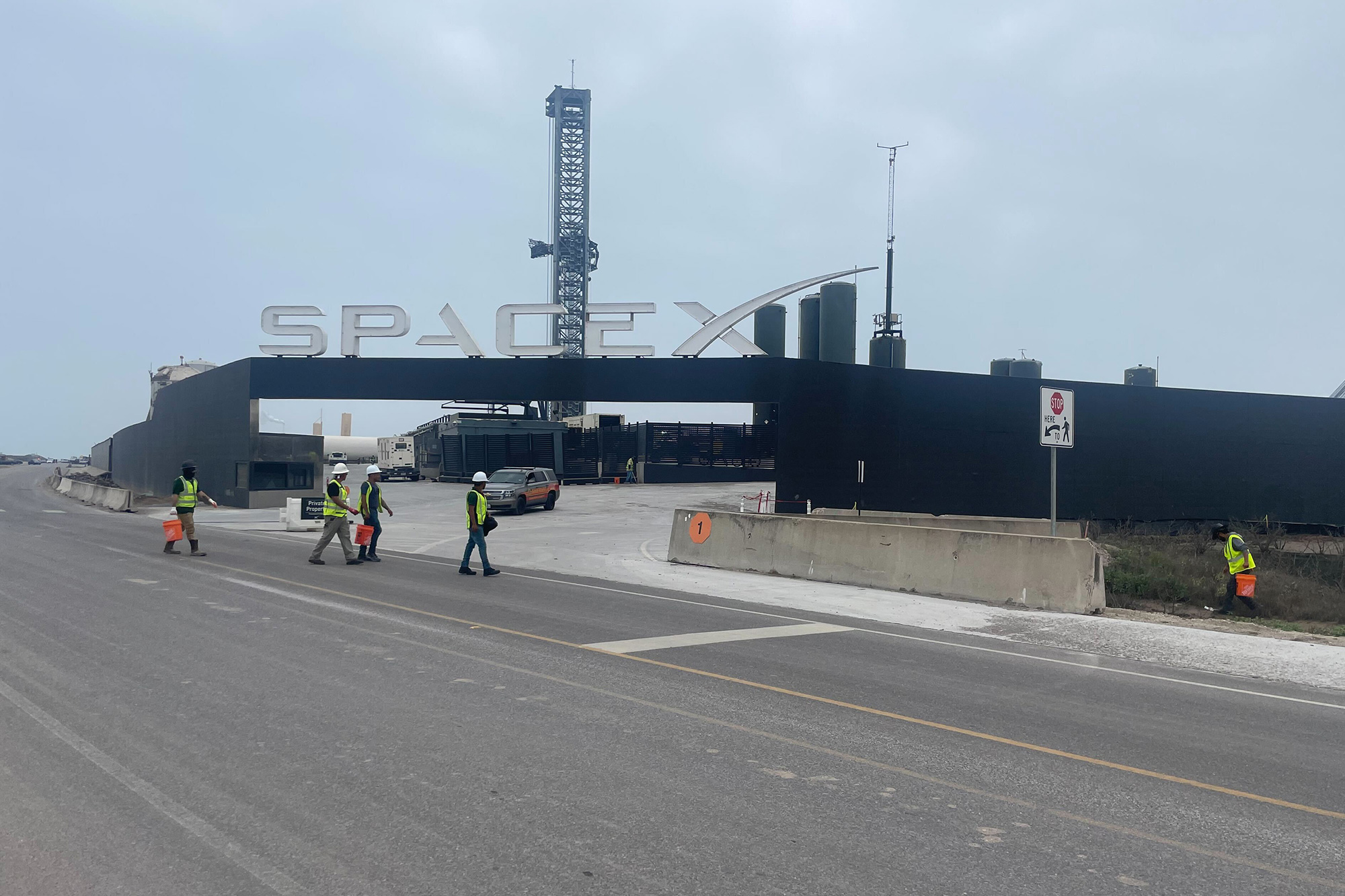 Members of an unaffiliated cleanup crew pick up debris around SpaceX Starbase after the Starship launch near Brownsville, Texas, on March 14.