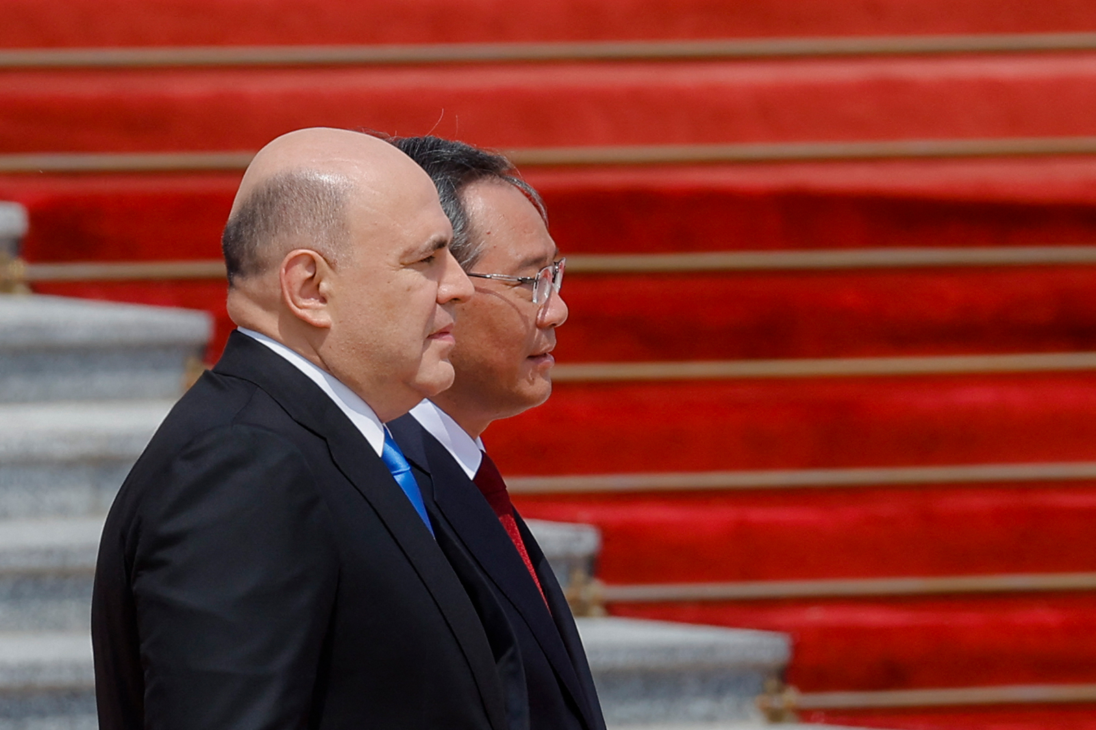 Mikhail Mishustin and Chinese Premier Li Qiang attend a welcome ceremony in Beijing on May 24.
