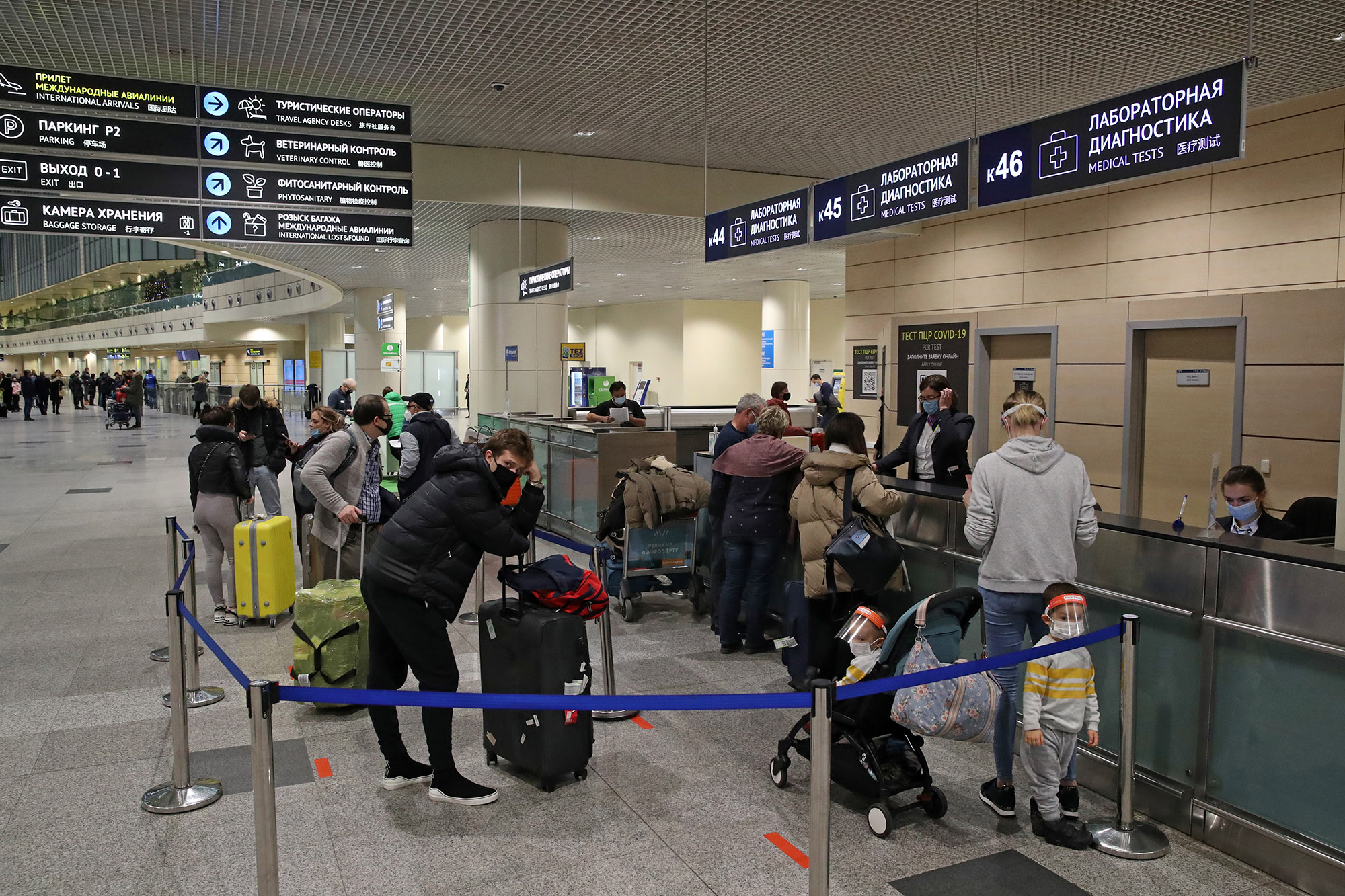 Travelers wait to take pre-departure Covid-19 tests at the Domodedovo International Airport in Moscow before flying to London, on December 21, 2020. 