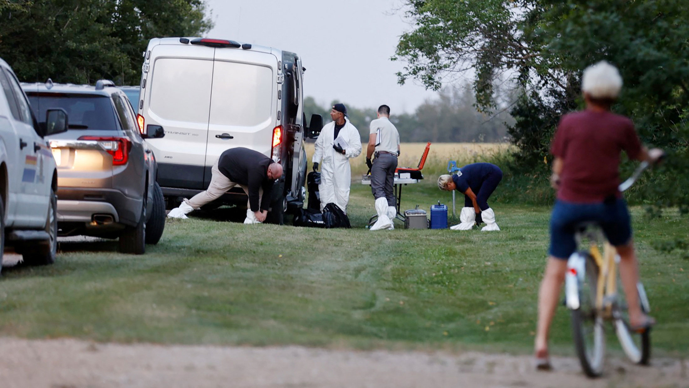 On Sunday, a police forensic team investigates a crime scene in Weldon, Saskatchewan.