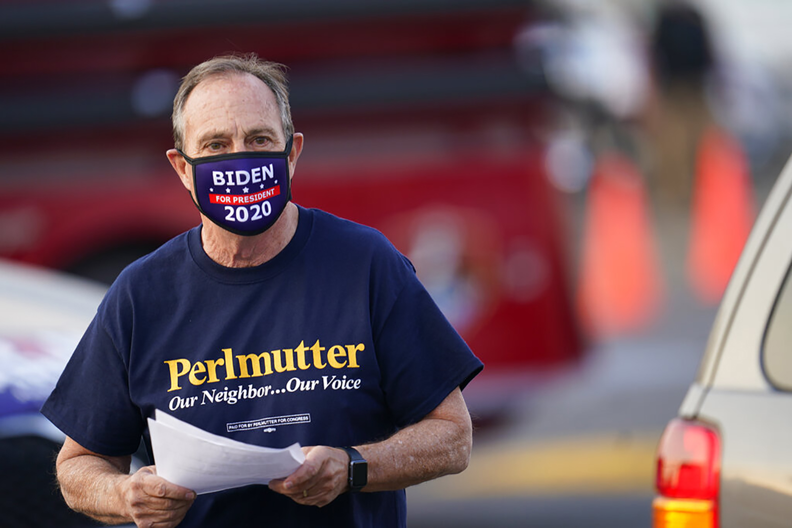 Rep. Ed Perlmutter hands out flyers during an election rally on October 8, in Denver.