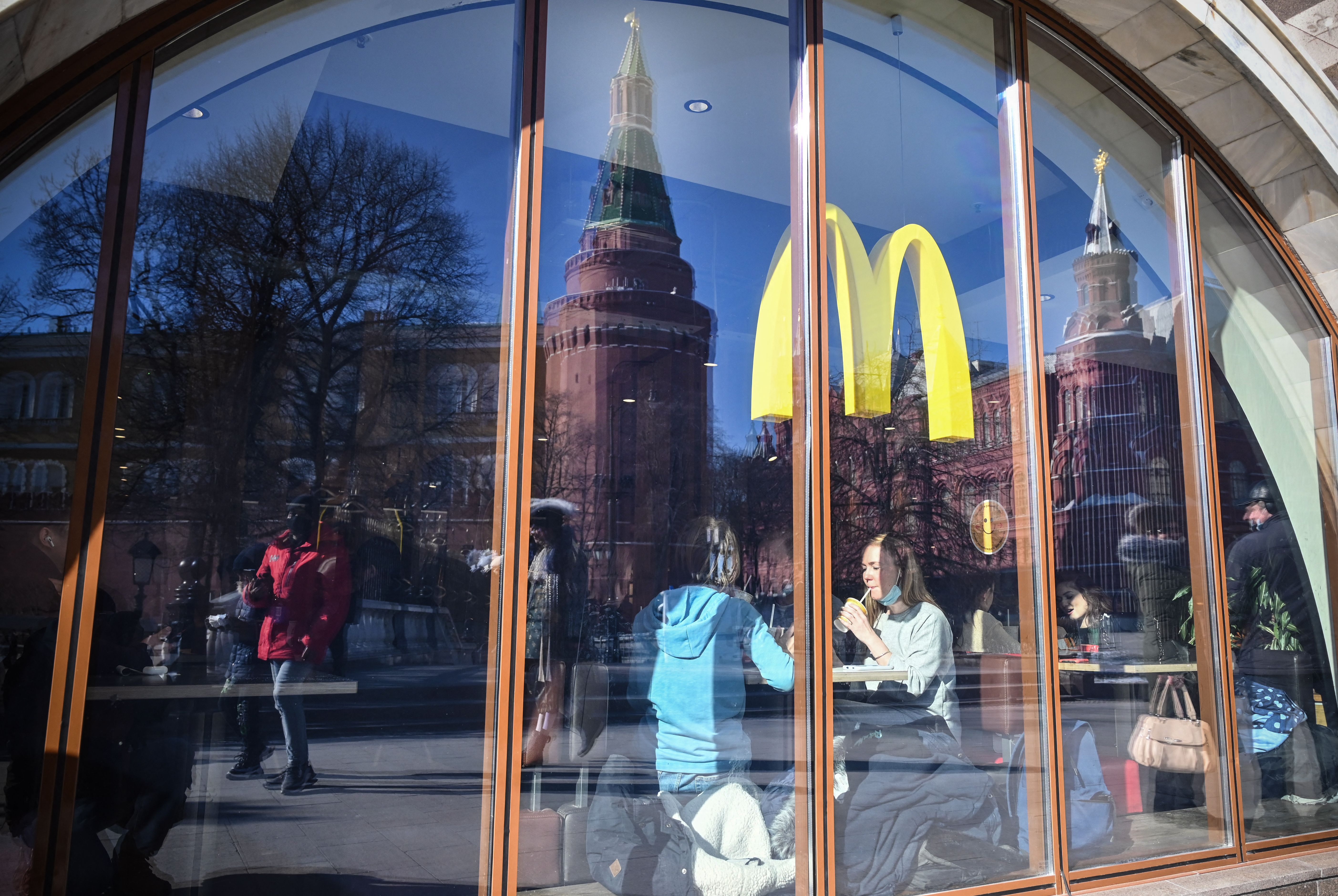 People have a lunch a McDonald's restaurant next to the Kremlin in Moscow, Russia, on March 10.