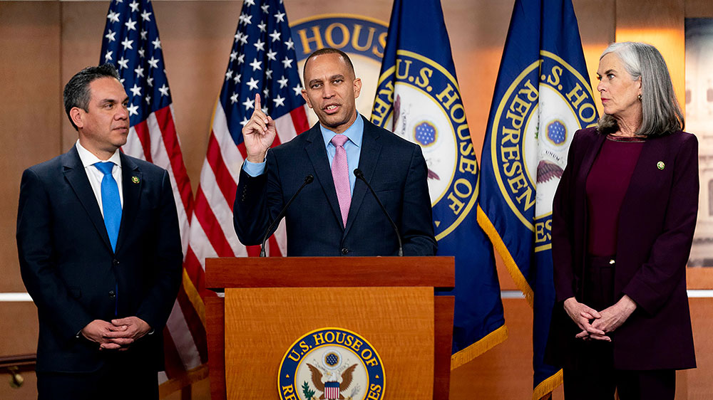 Jeffries, accompanied by incoming House Minority Whip Rep. Katherine Clark,  and incoming Incoming Democratic Caucus Chair Pete Aguilar, speaks at a news conference  on Capitol Hill on Tuesday, January 3. 