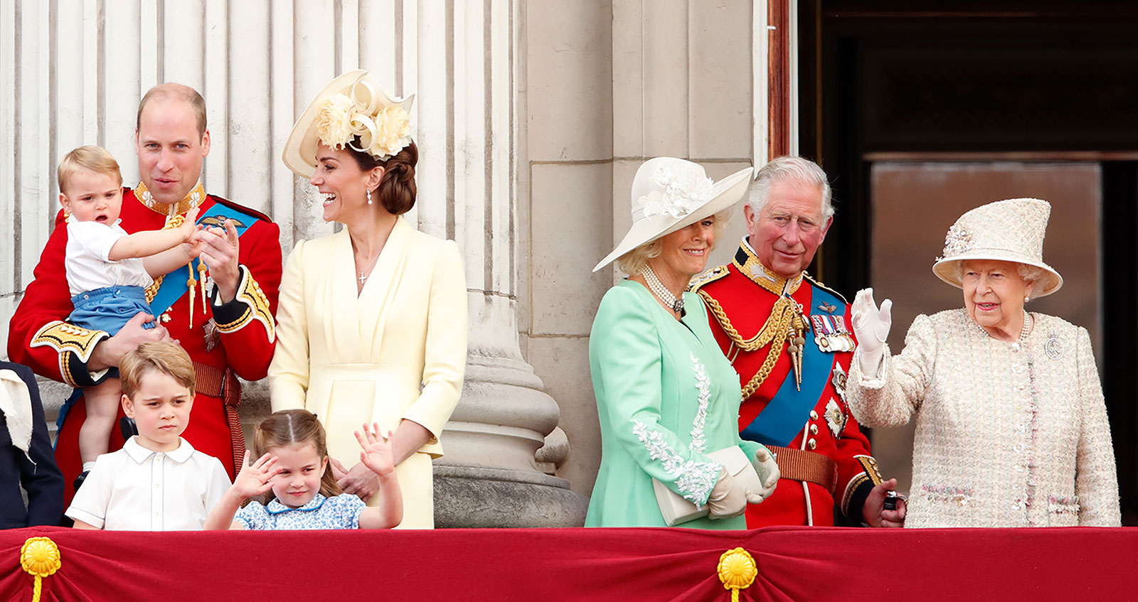 Prince Louis holds his hands over his ears as jets roar over Buckingham Palace during the Trooping the Colour parade with other members of they Royal family in London in June 2022. From left are Camilla, the Duchess of Cornwall; Prince Charles; Queen Elizabeth II; Louis; Catherine; Charlotte; George; and William. 