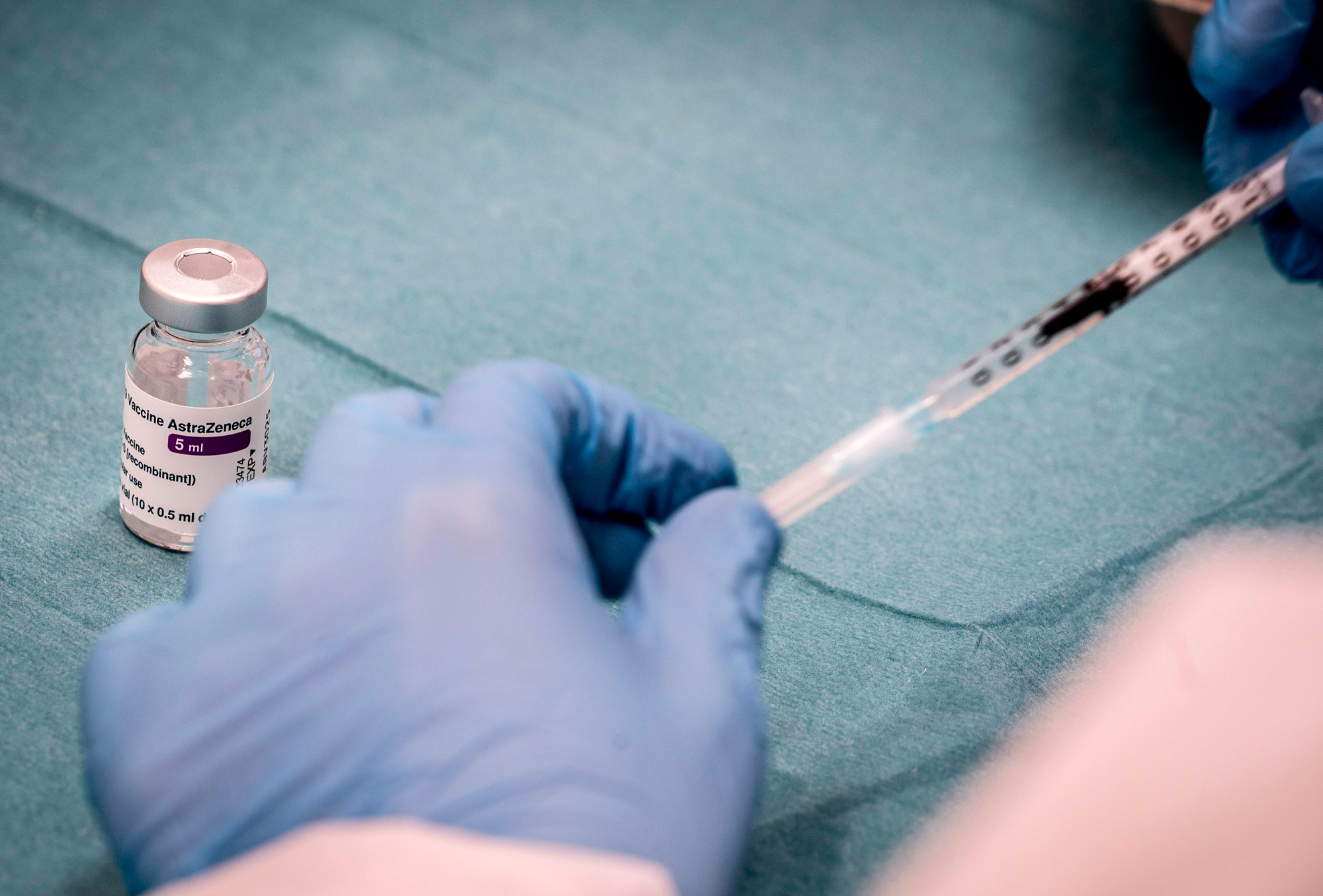 Medical personnel prepares a syringe for vaccination with the AstraZeneca vaccine at the Region Hovedstaden's vaccine center in Copenhagen, Denmark, on February 11.