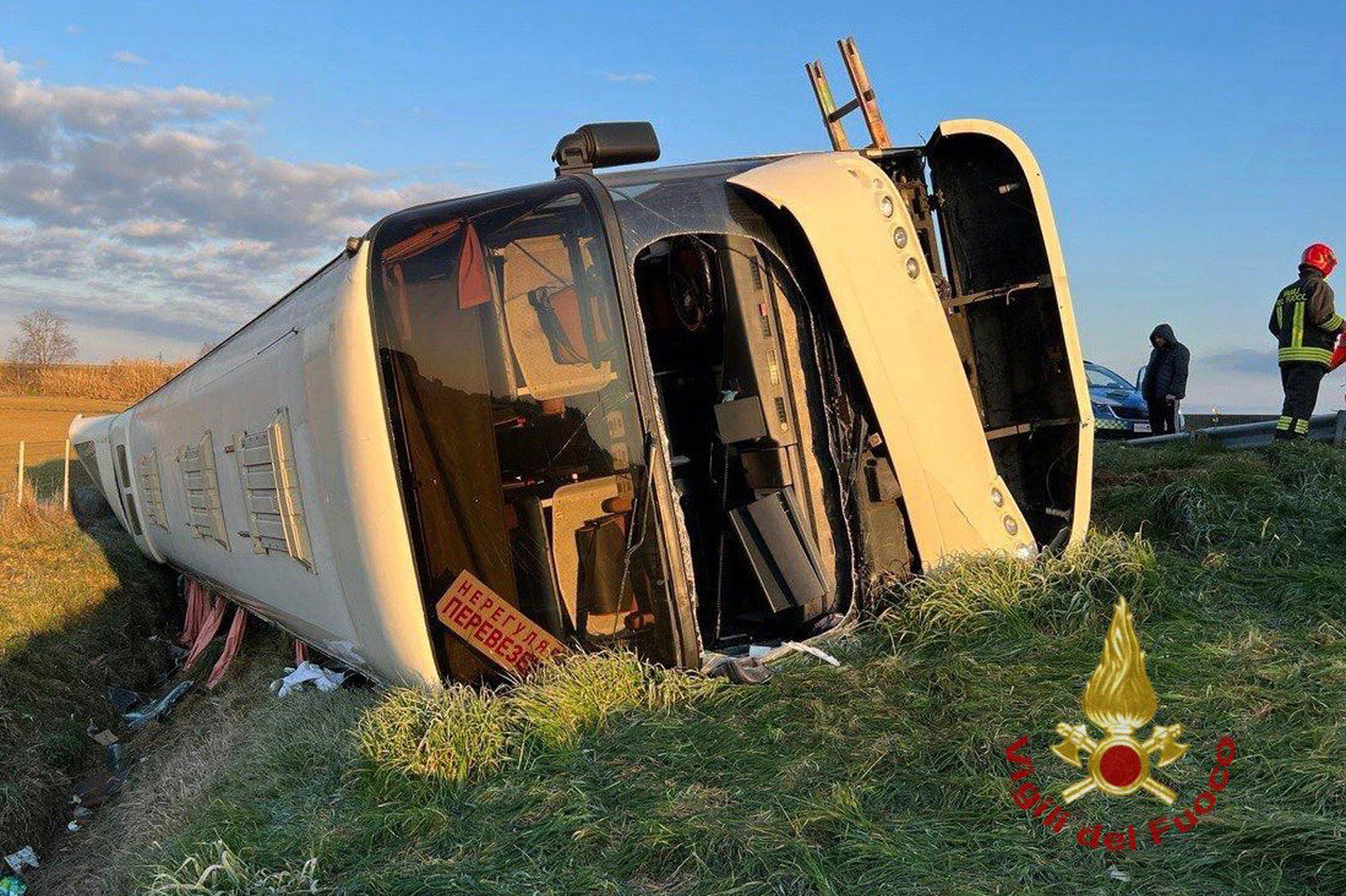 A bus lies on its side after overturning near Forli, Italy, on Sunday, March 13. 