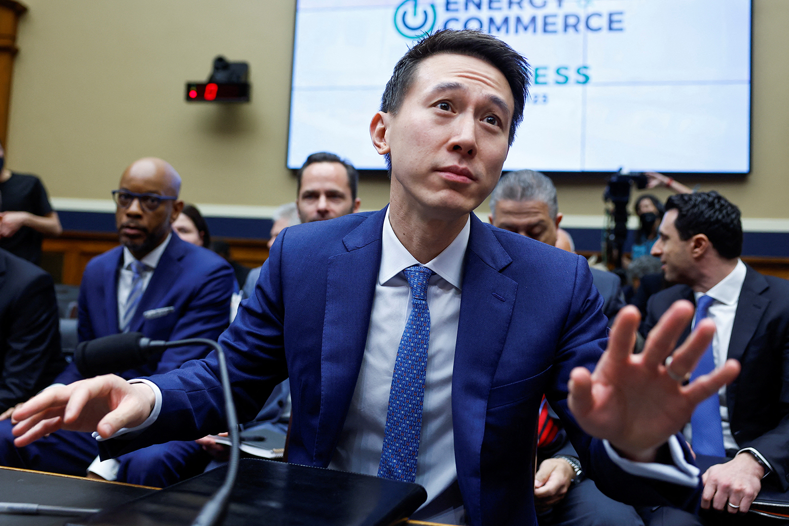 TikTok Chief Executive Shou Zi Chew reacts during a session for him to testify before a House Energy and Commerce Committee hearing entitled "TikTok: How Congress can Safeguard American Data Privacy and Protect Children from Online Harms," as lawmakers scrutinize the Chinese-owned video-sharing app, on Capitol Hill today.