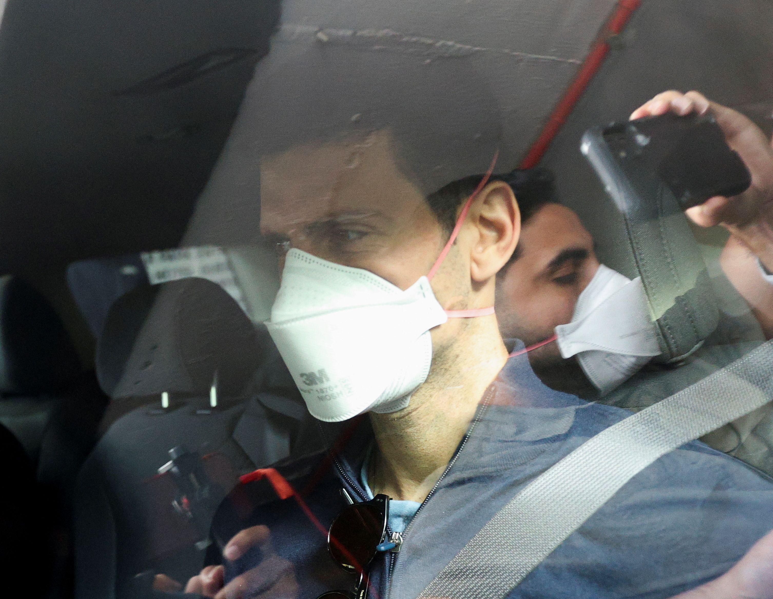 Tennis player Novak Djokovic leaves his hotel to meet with his legal team in Melbourne, Australia, on Sunday. 