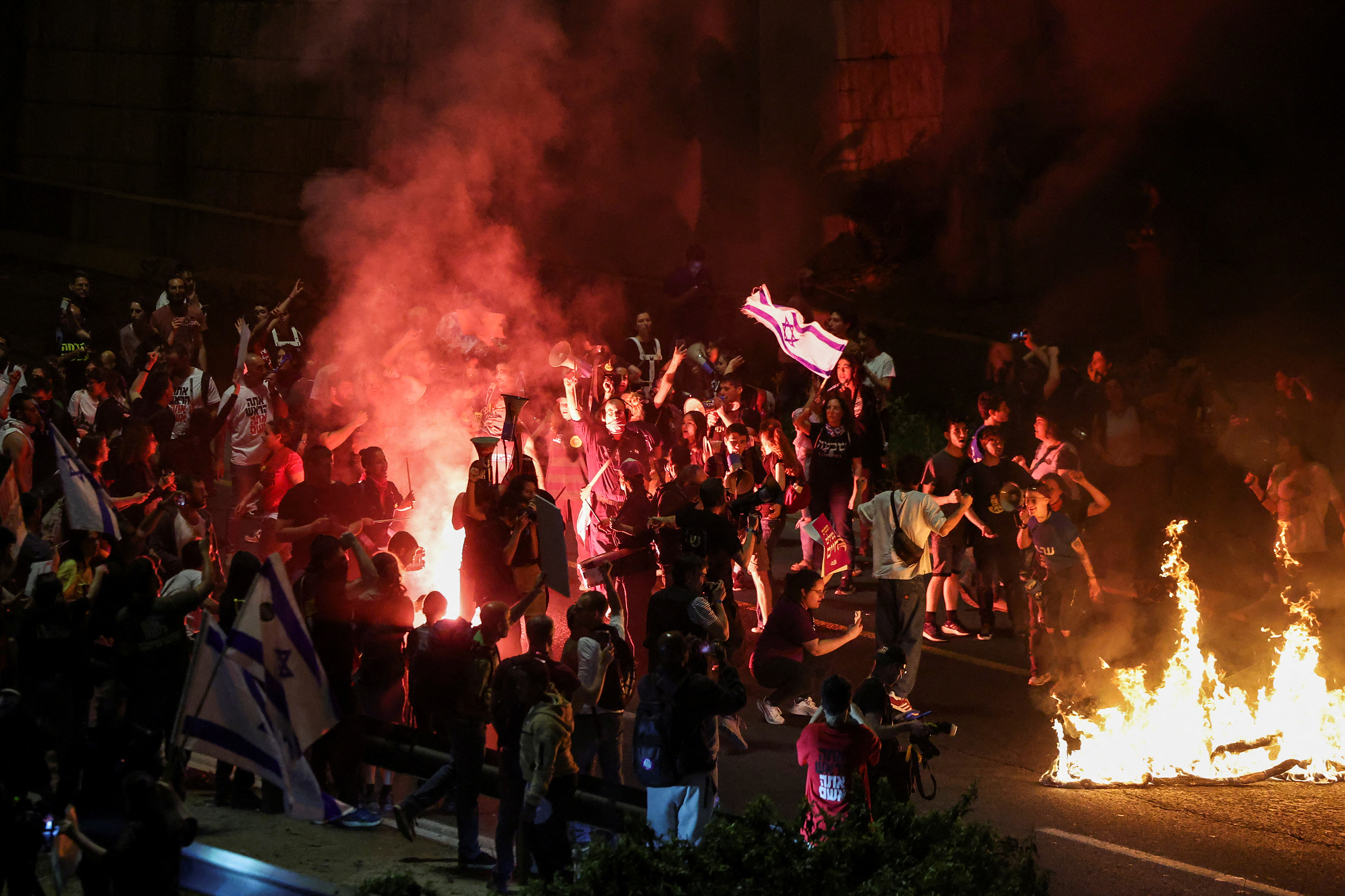 Anti-government protesters launch a prolonged demonstration calling for Israeli Prime Minister, Benjamin Netanyahu's government to resign and a general election in front of the Knesset, the Israeli parliament, in Jerusalem, on March 31.
