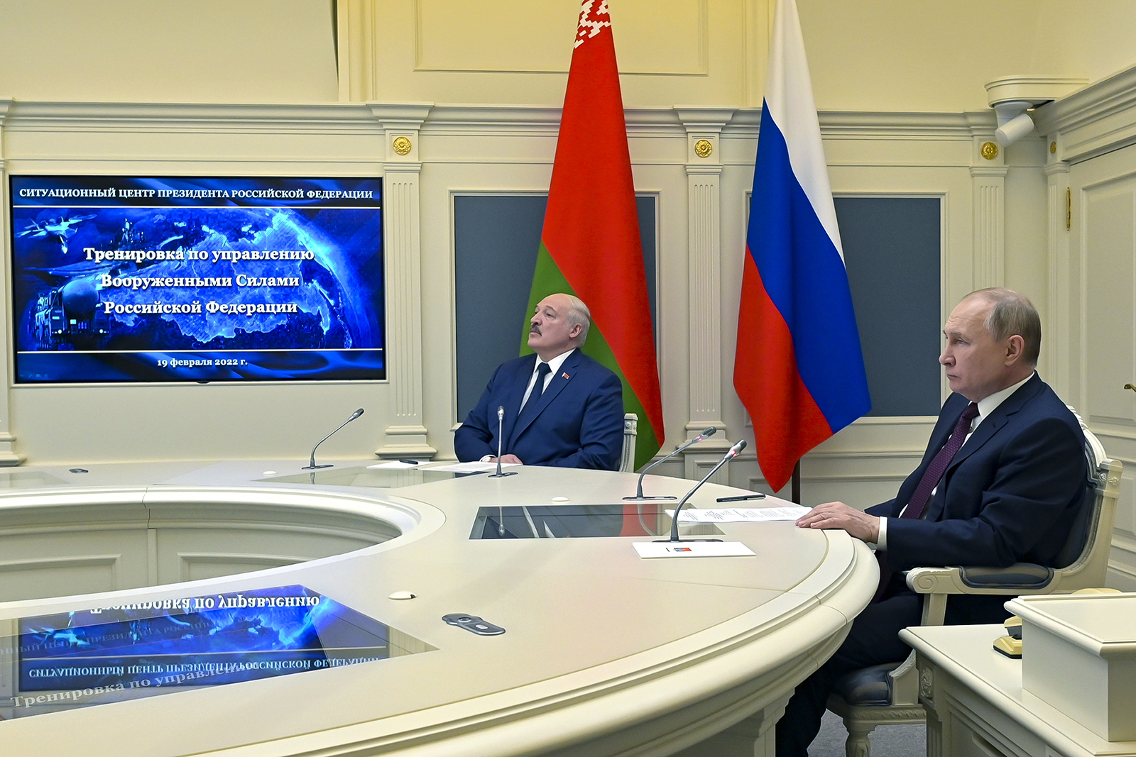 Russian President Vladimir Putin, right, and Belarusian President Alexander Lukashenko watch military drills via videoconference in Moscow, on February 19. 