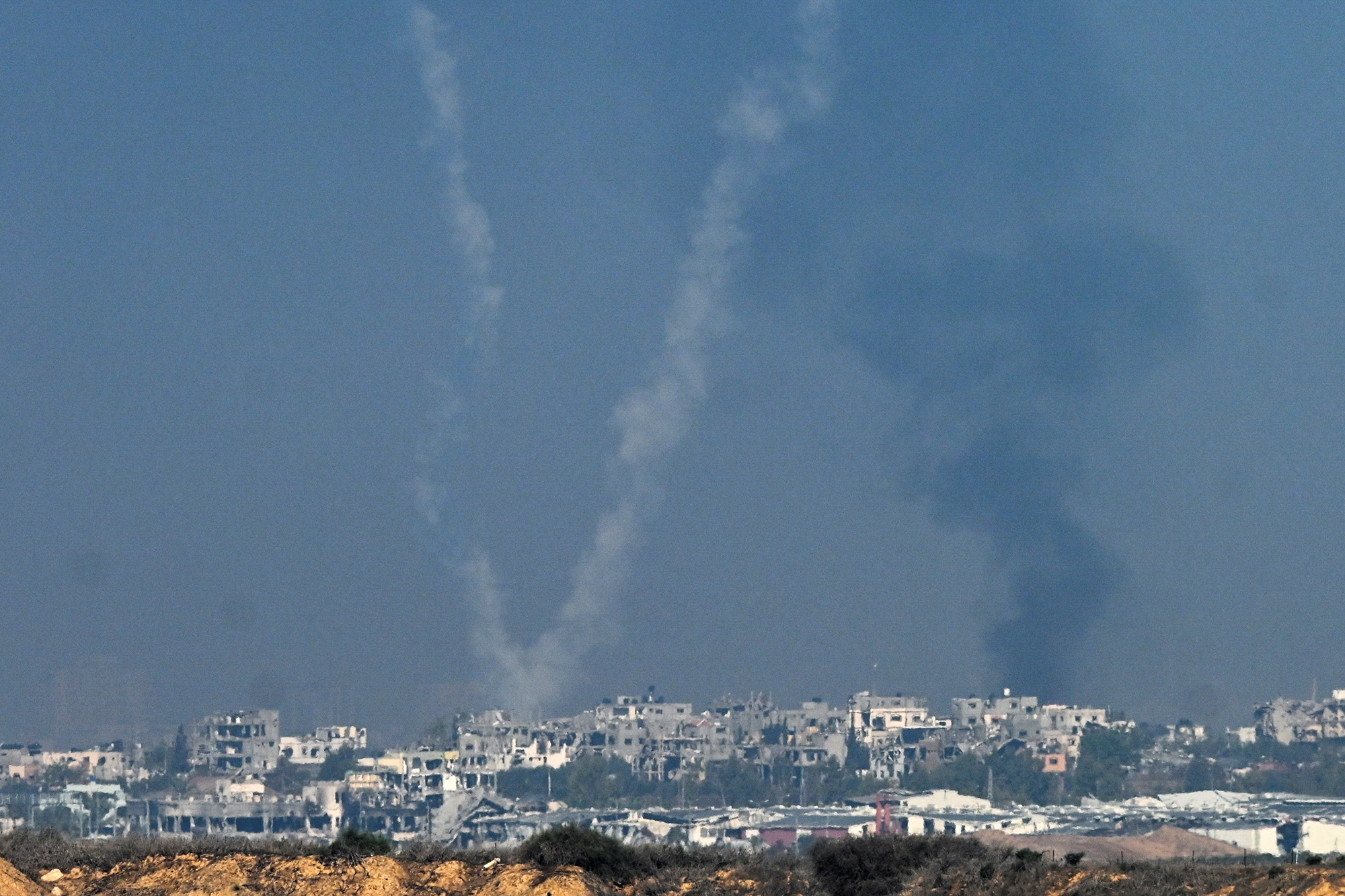 Rockets are launched from the Gaza Strip into Israel as seen from Israel's border with Gaza in southern Israel, on December 1.