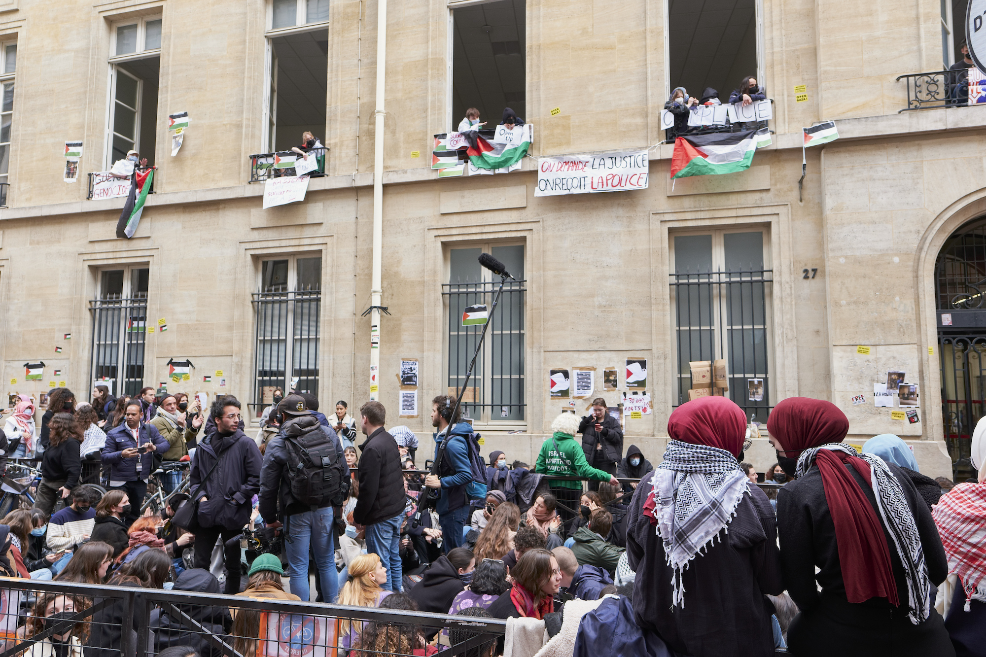  Students are seen in front of the Sciences Po University in Paris on Friday.