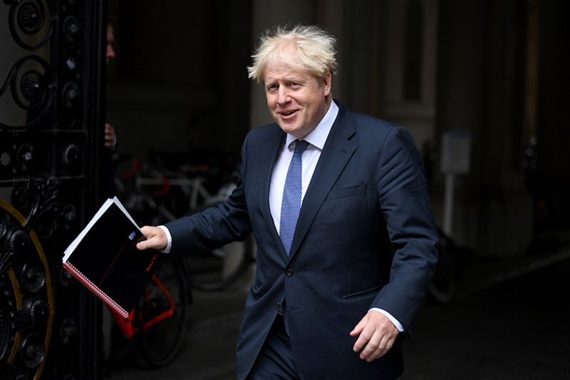 British Prime Minister Boris Johnson leaves Downing Street on September 8, in London.