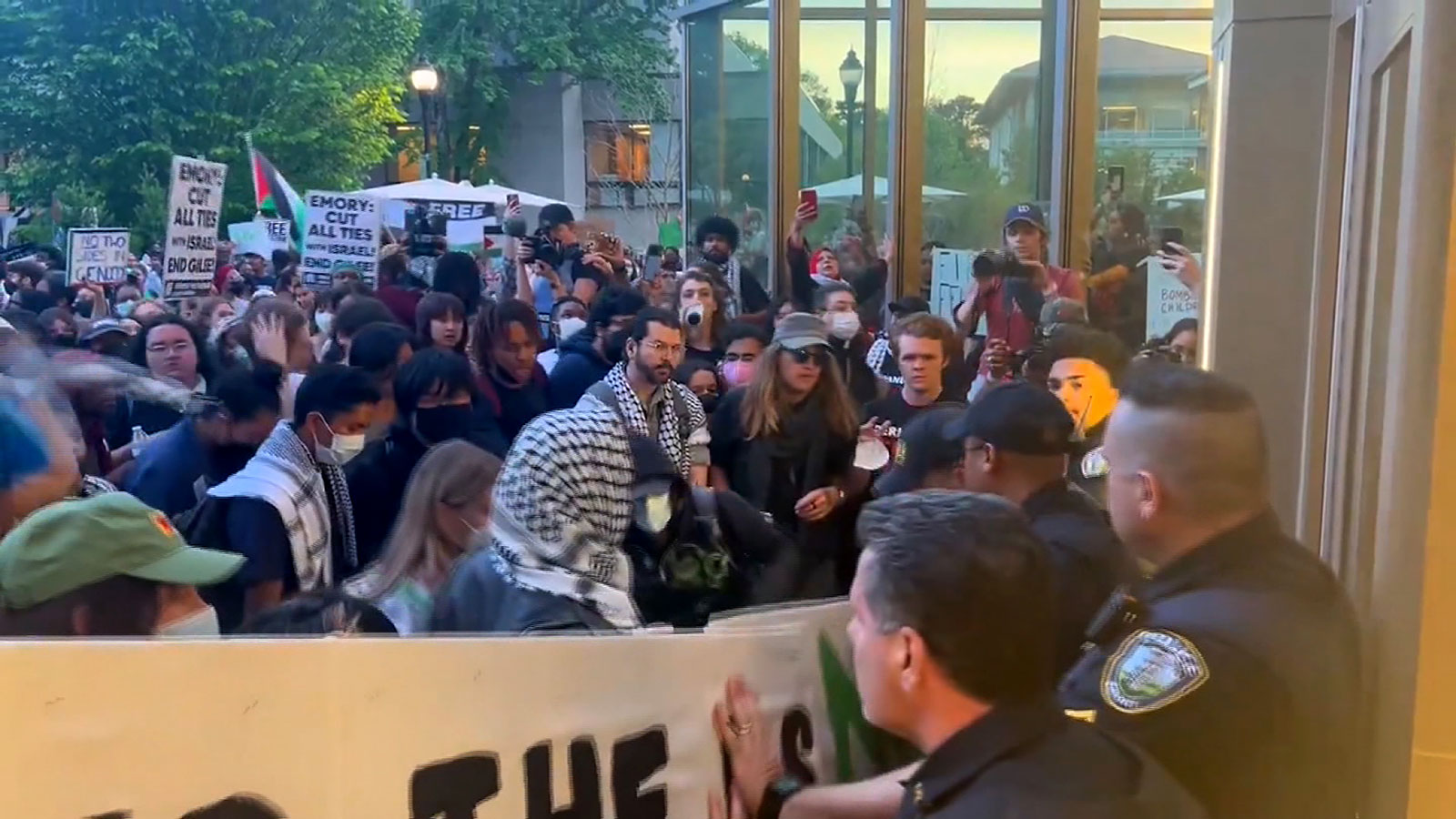 A confrontation between Emory University protesters and police resulted in officers being pressed up against a building on campus. 