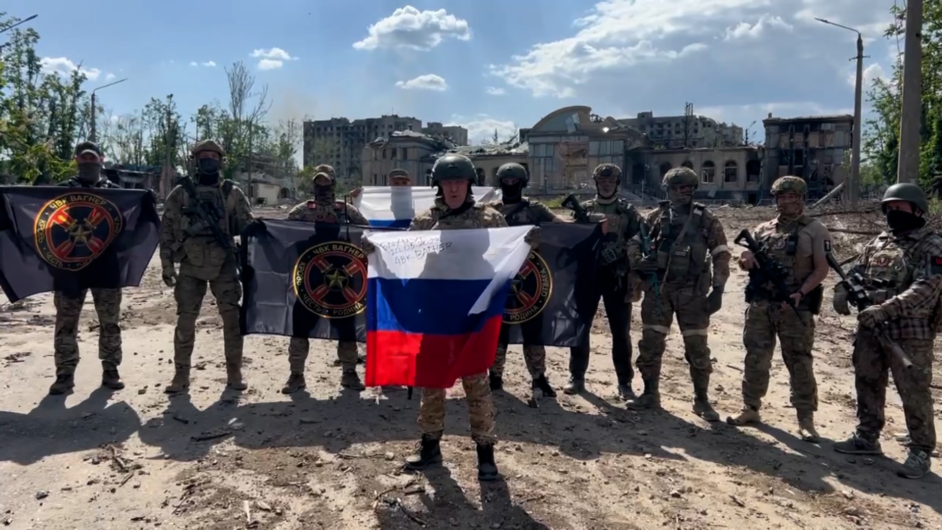 Yevgeny Prigozhin, the head of the Wagner private military group, holds a Russian flag in this image from a video released on May 20. 