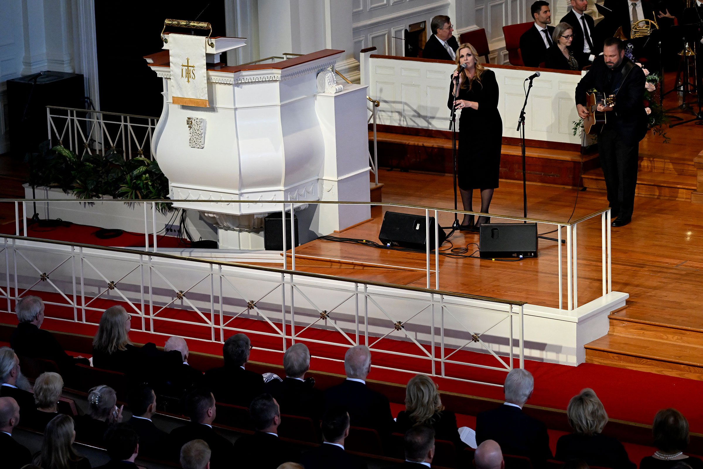 Trisha Yearwood and Garth Brooks perform during a tribute service for former first lady Rosalynn Carter on Tuesday in Atlanta. 