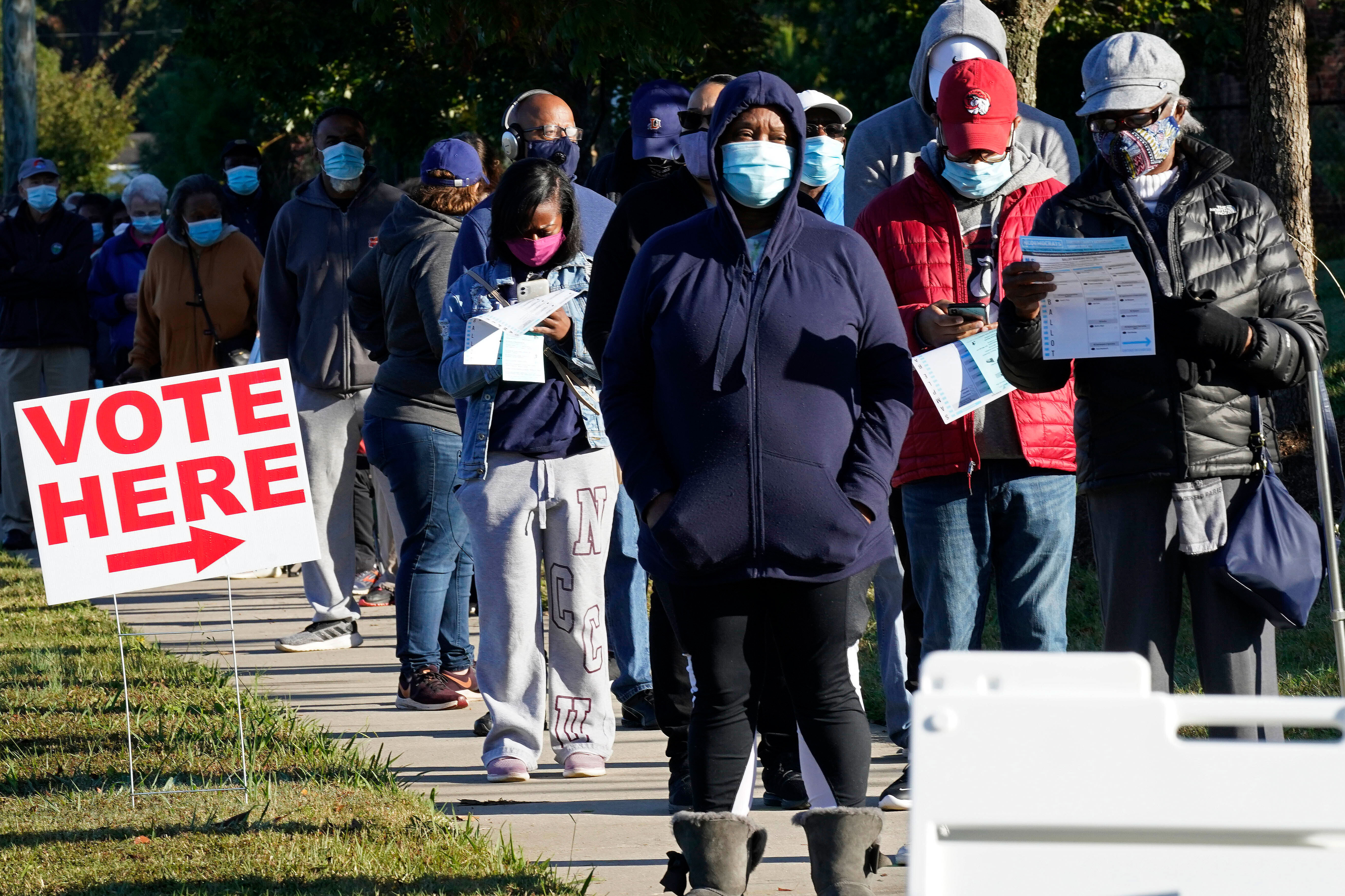 Voters wait to cast their ballots in Durham, North Carolina, on October 15.