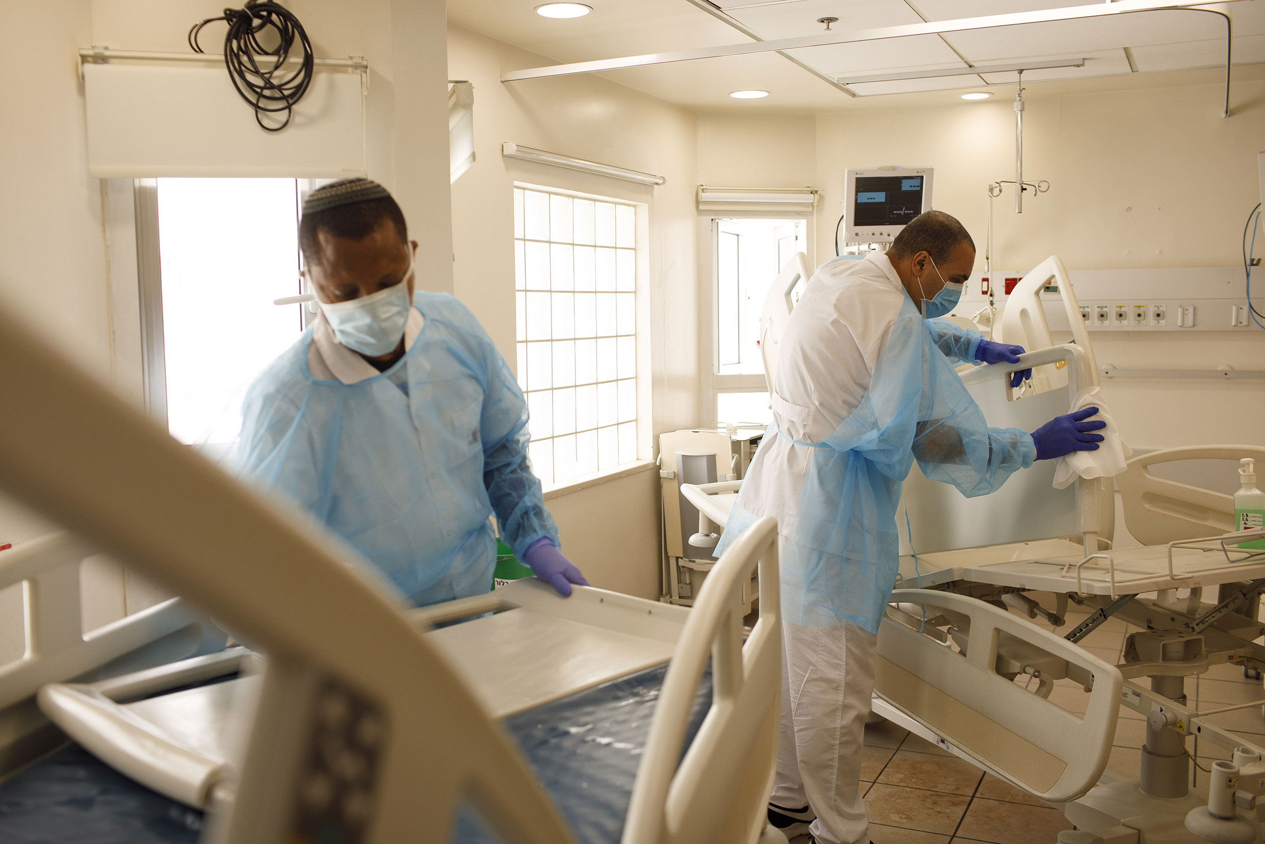 Medical staff disinfect beds and equipment at the Tel Aviv Sourasky Medical Center on Thursday, March 19.
