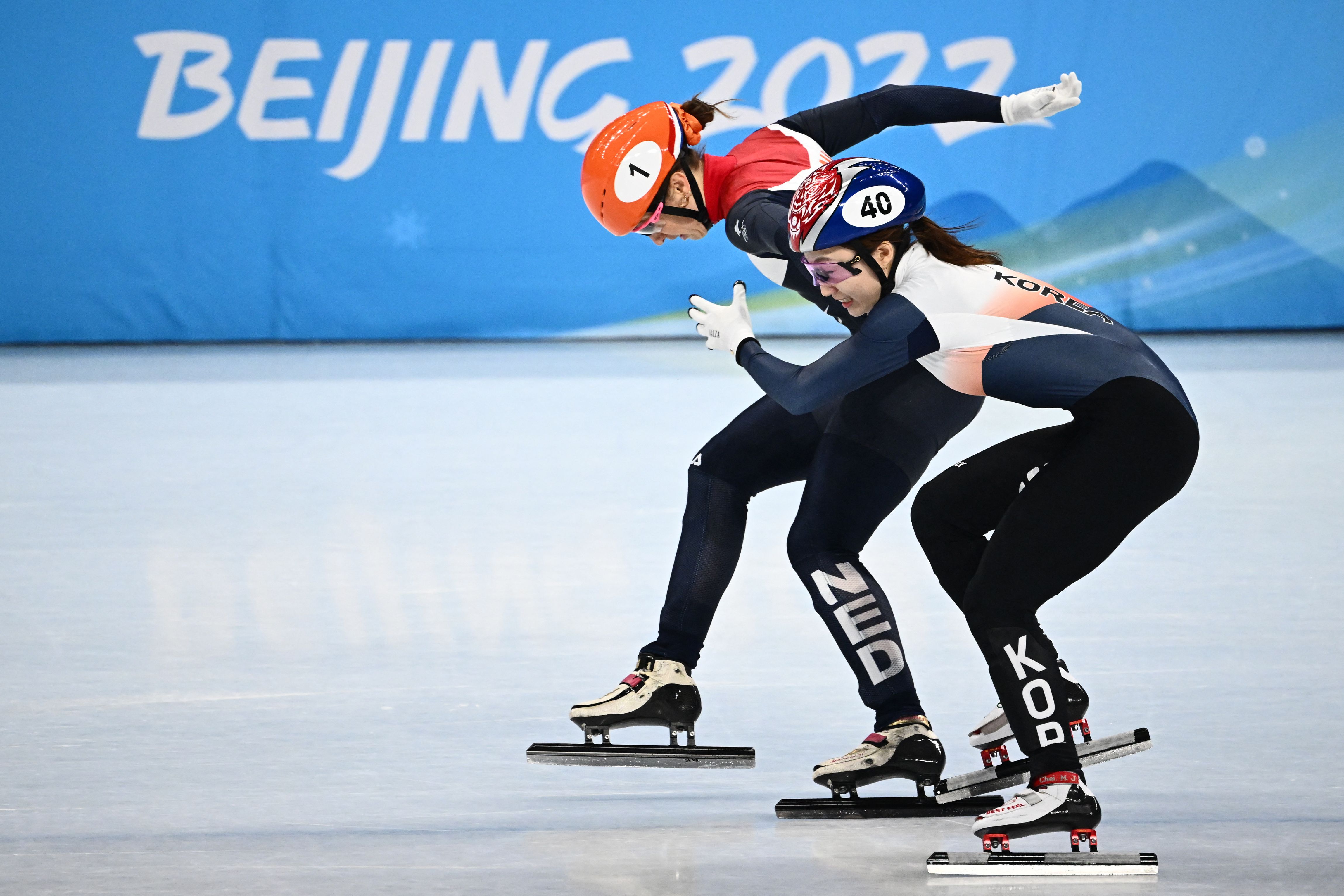 Netherlands' Suzanne Schulting crosses the finish line just ahead of South Korea's Choi Min-jeong in the final of the women's 1,000m short track speed skating event on February 11.