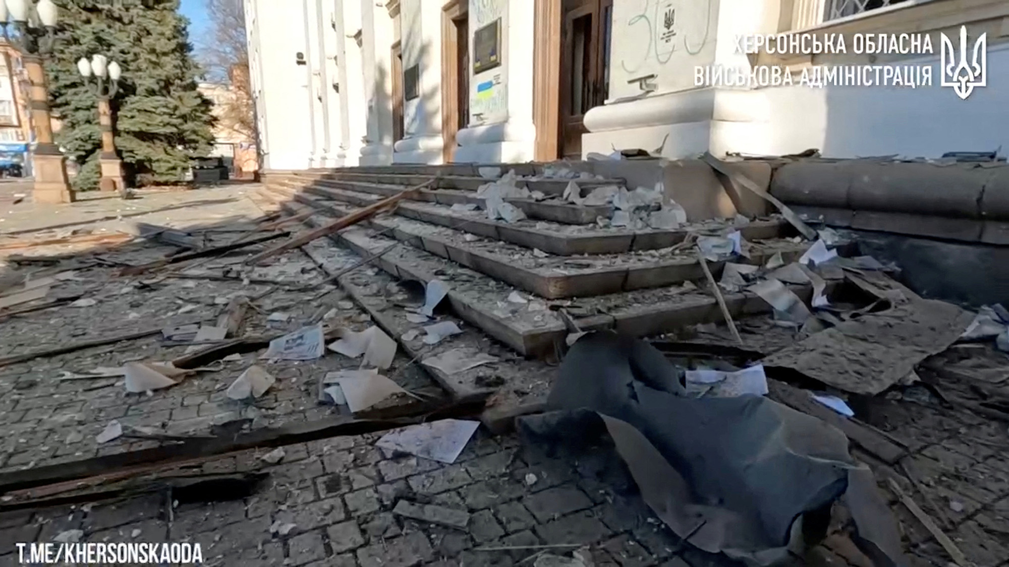 Damage at Svobody Square after the landmark Kherson Regional State Administration building was reportedly hit by rocket fire in Kherson, Ukraine, in this still image from video released on December 14.