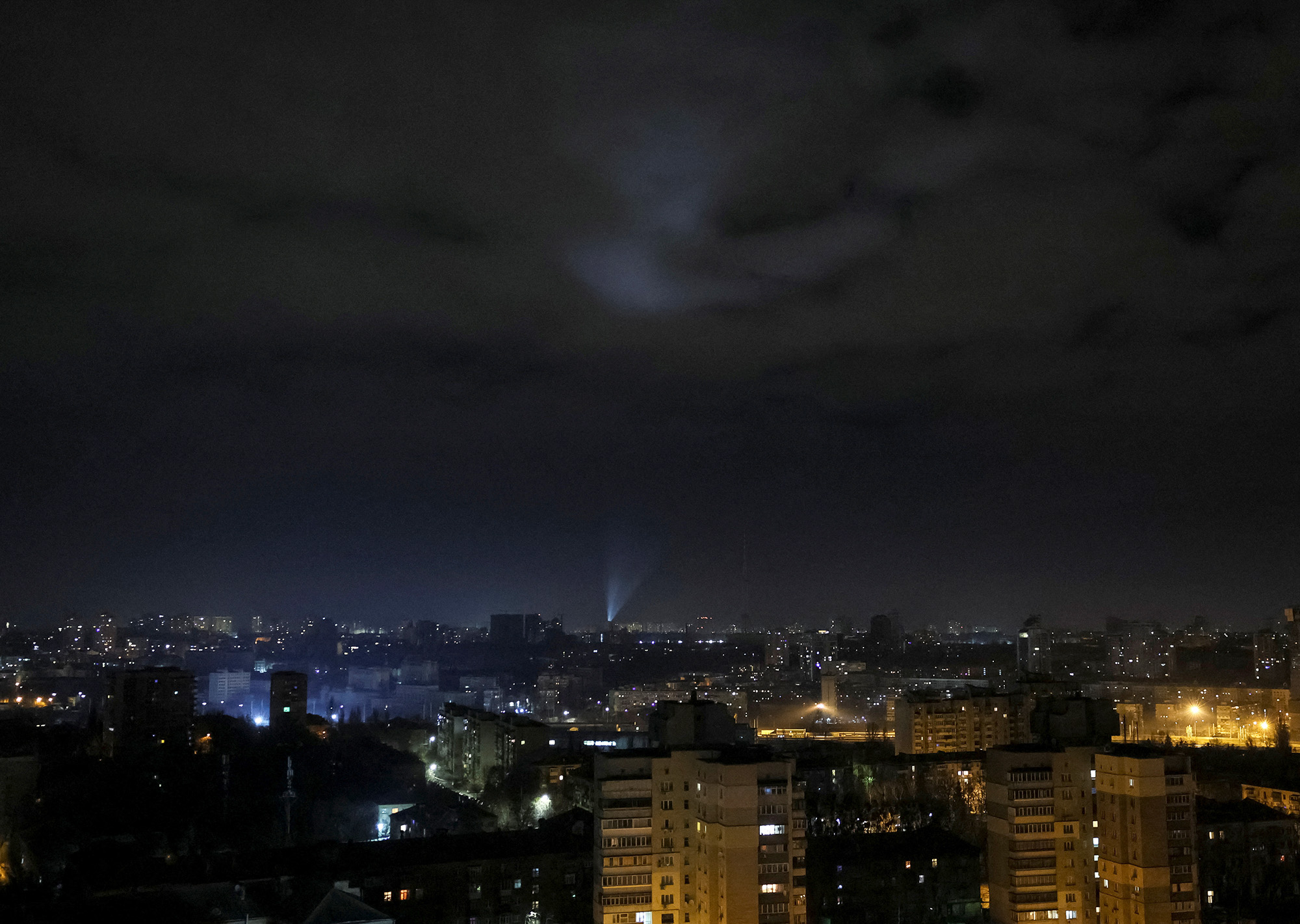 Ukrainian servicemen use searchlights as they search for drones in Kyiv, Ukraine, on January 1.