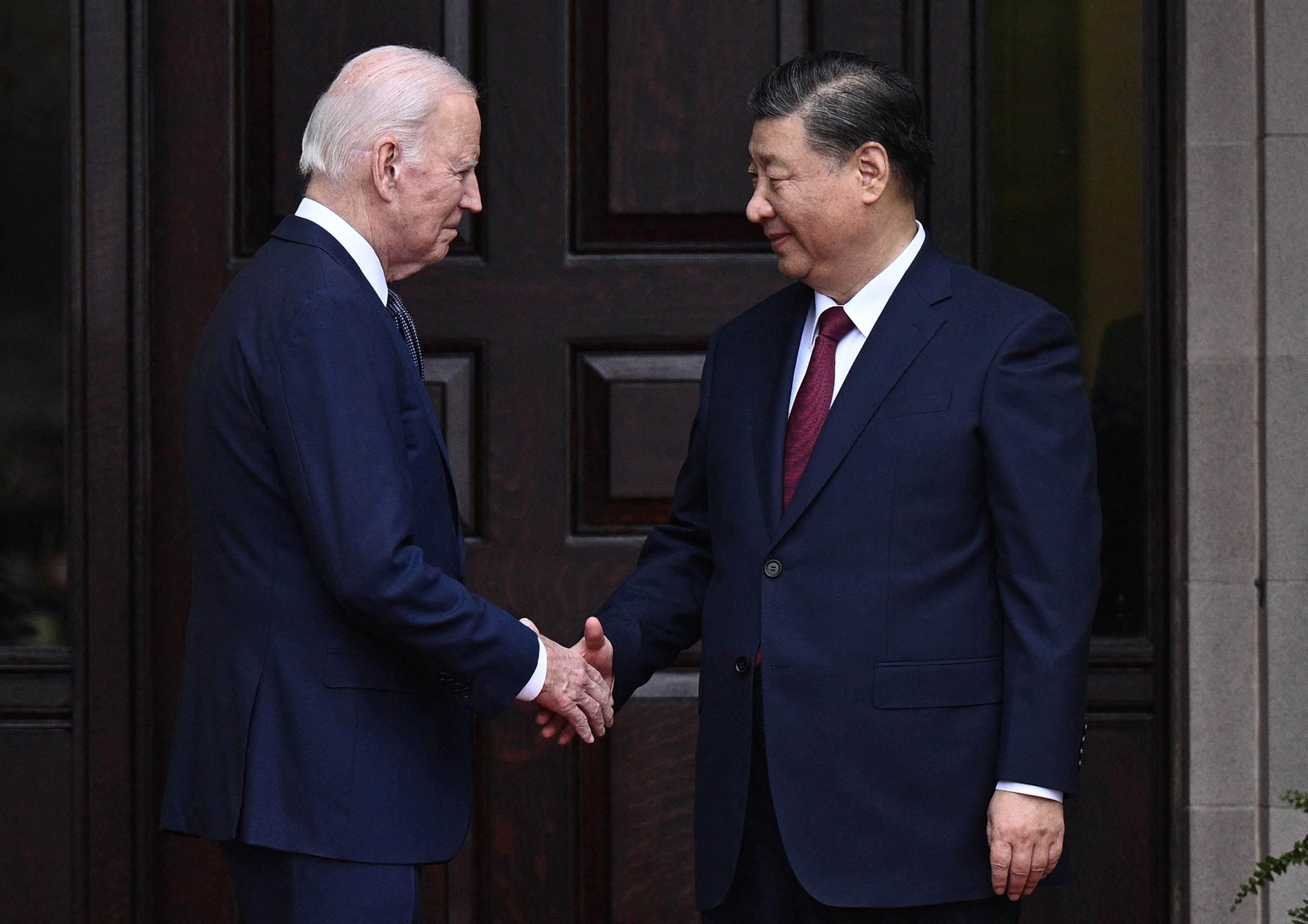 US President Joe Biden greets Chinese President Xi Jinping before a meeting during the Asia-Pacific Economic Cooperation (APEC) Leaders' week in Woodside, California, on November 15.