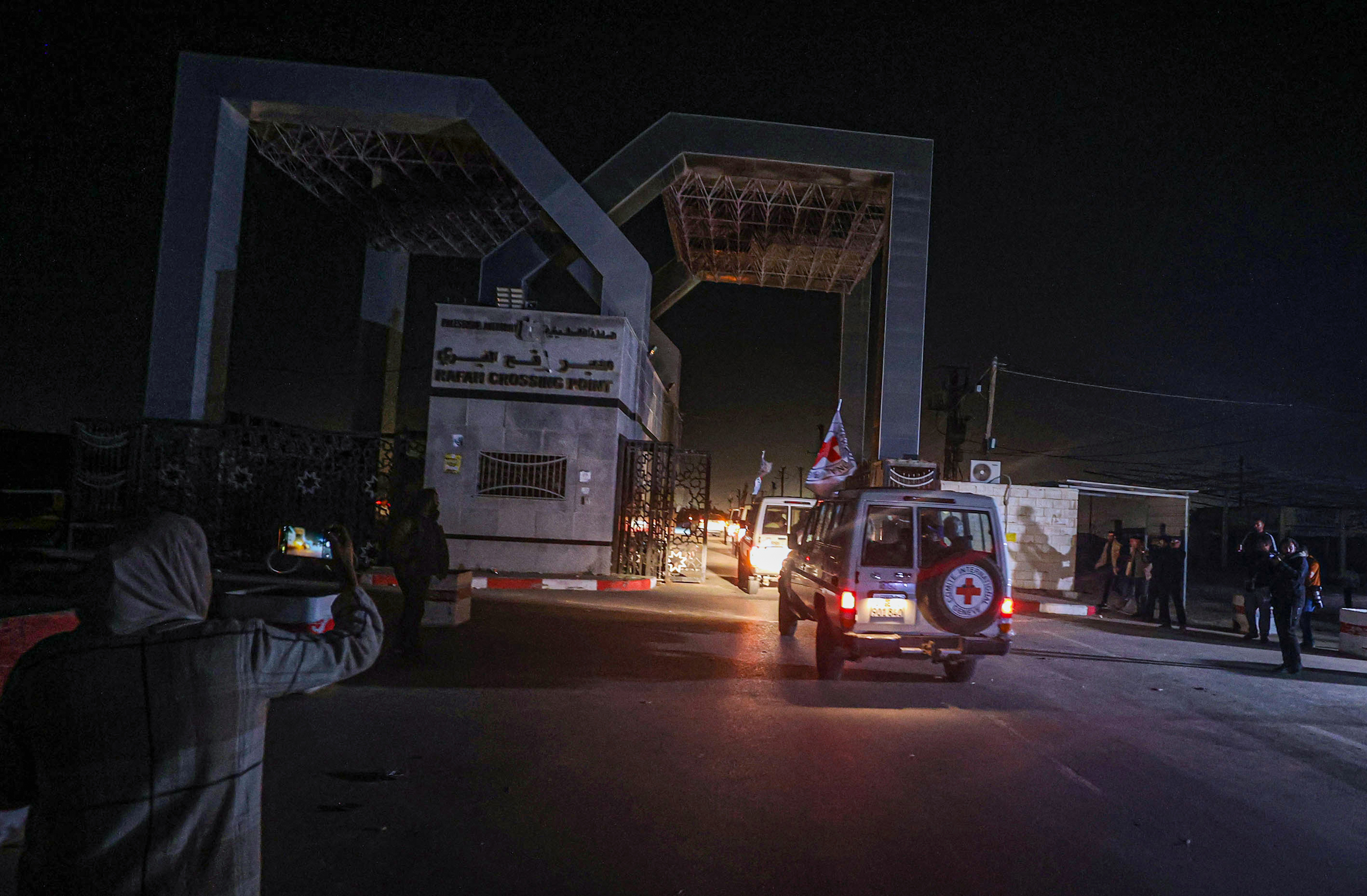 International Red Cross vehicles transport freed hostages through the Rafah border crossing in Gaza on November 24. 