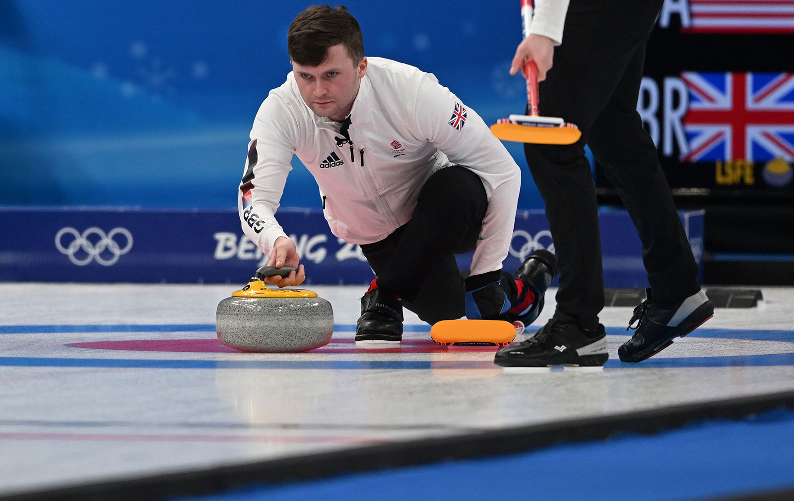 Great Britain's Bruce Mouat delivers a stone during their semifinal match against the United States on February 17.