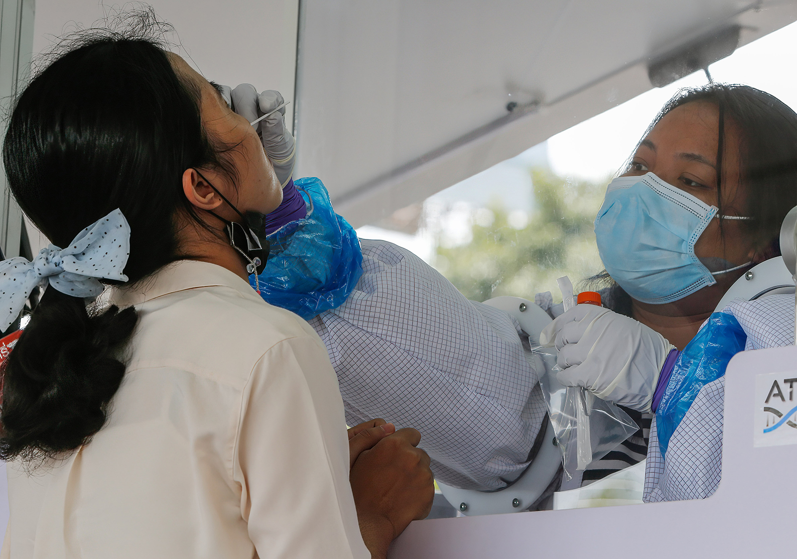 A healthcare worker collects a nasal swab at a mobile Covid-19 testing center in Bangkok, Thailand, on Thursday, May 20. 