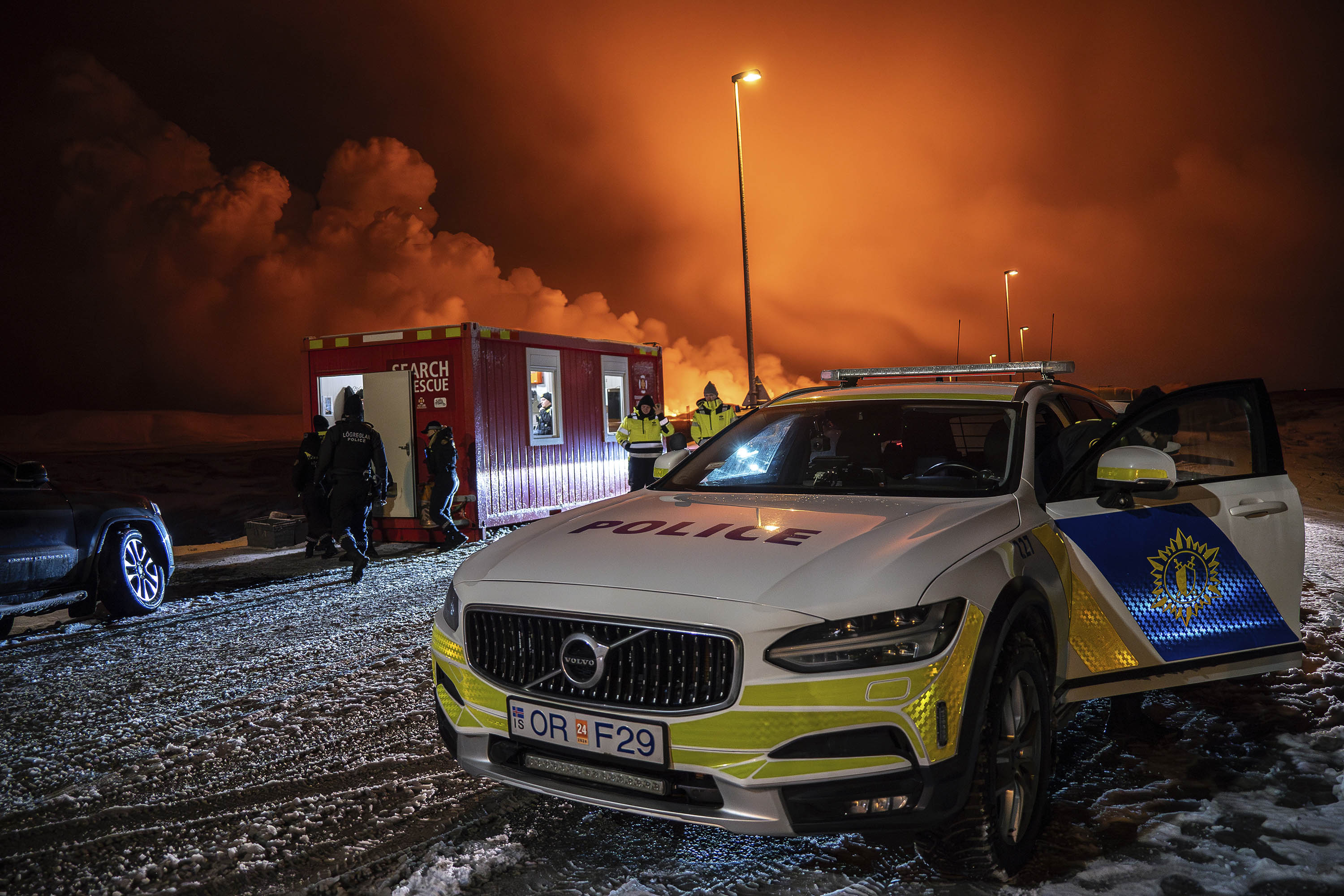 A police vehicle is parked at the entrance of the road to Grindavík, Iceland, on December 18. 