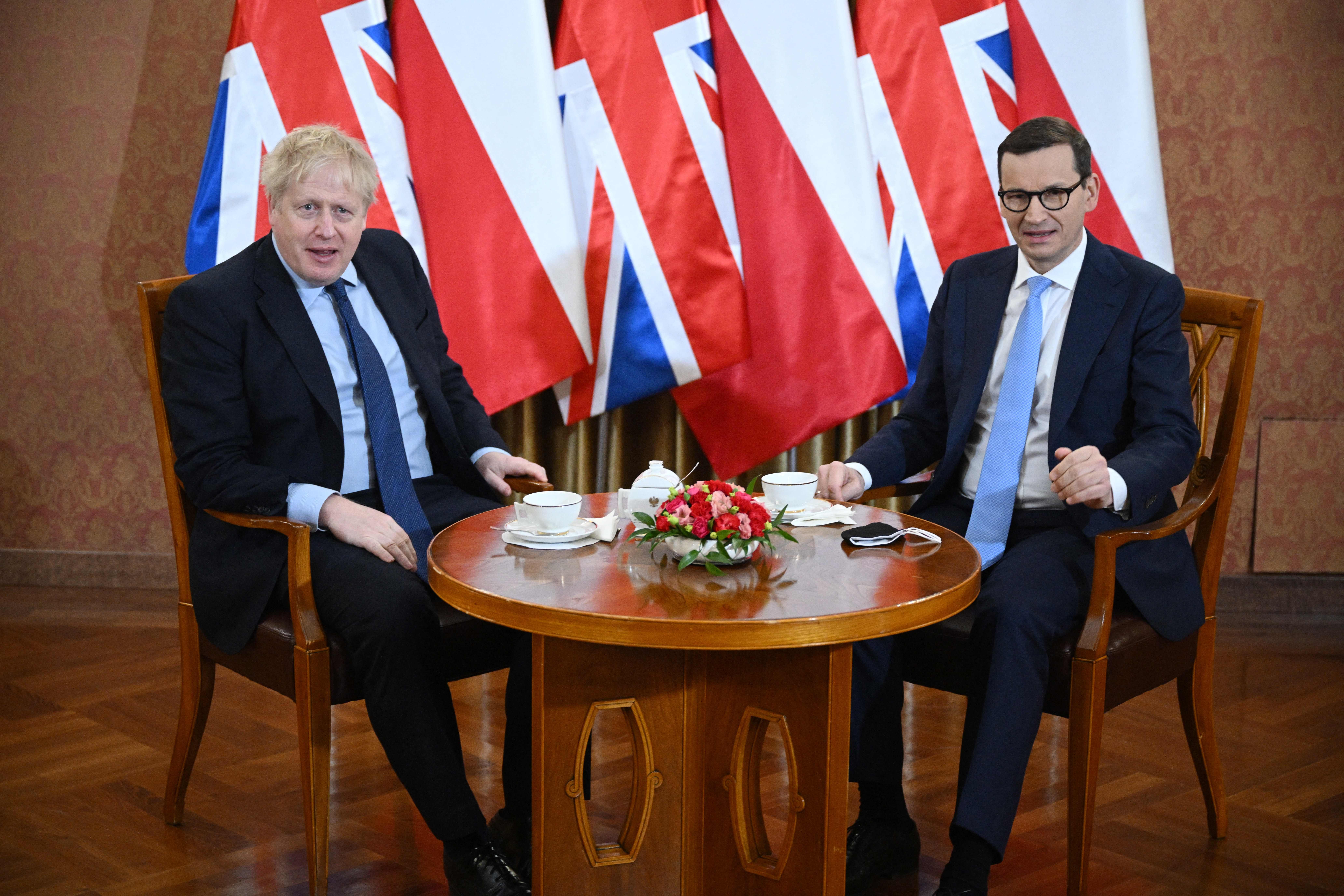 British Prime Minister Boris Johnson (L) and Polish Prime Minister Mateusz Morawiecki pictured together at the Chancellery in Warsaw, Poland on March 1.