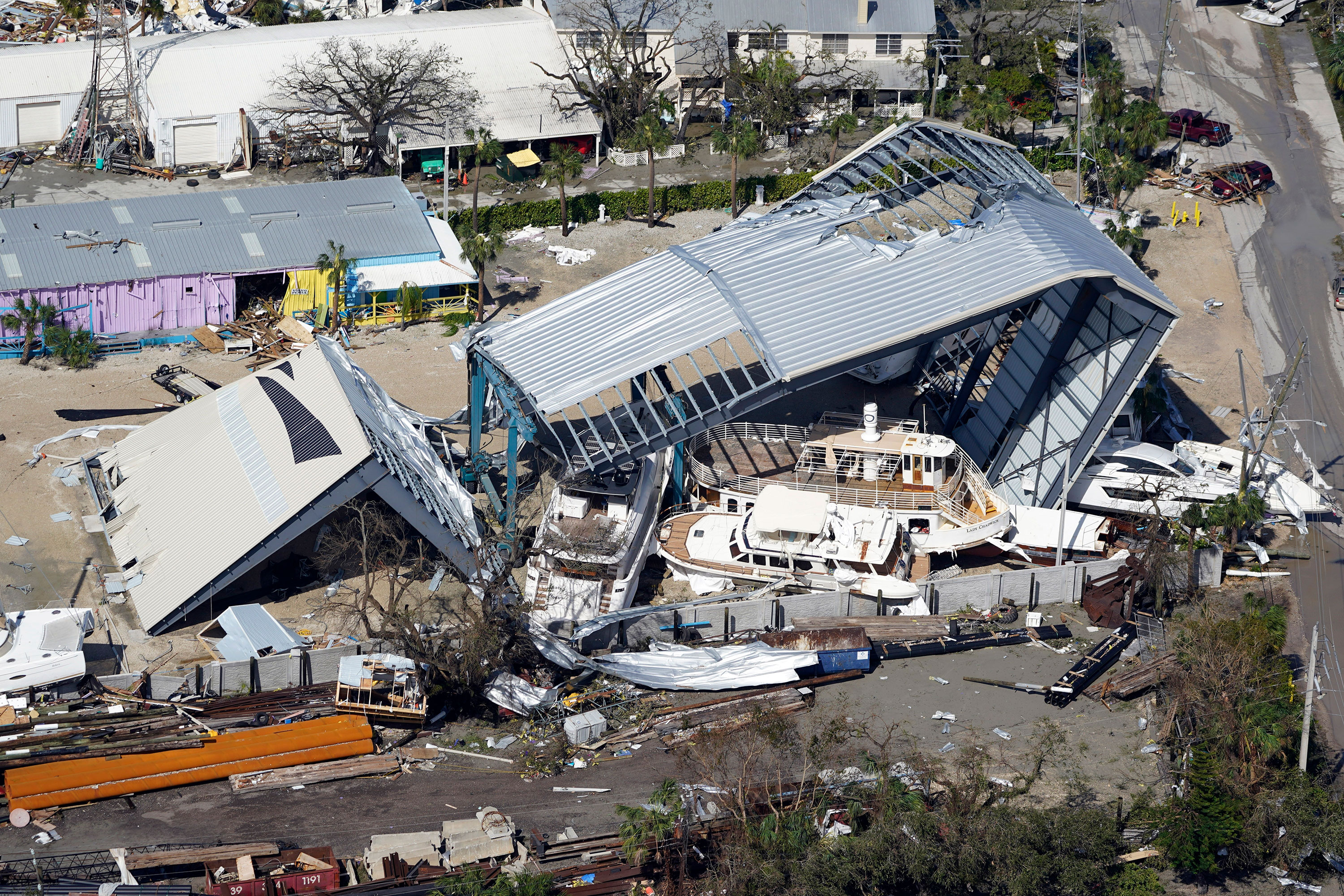 Boats are seen piled up around damaged structures in Fort Myers Beach, Florida.