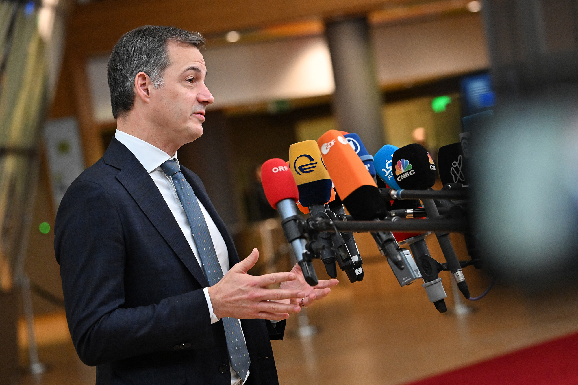 Belgium's Prime Minister, Alexander De Croo speaks to the press as he arrives at the European headquarters to attend the European Union summit, in Brussels, Belgium, on December 15.