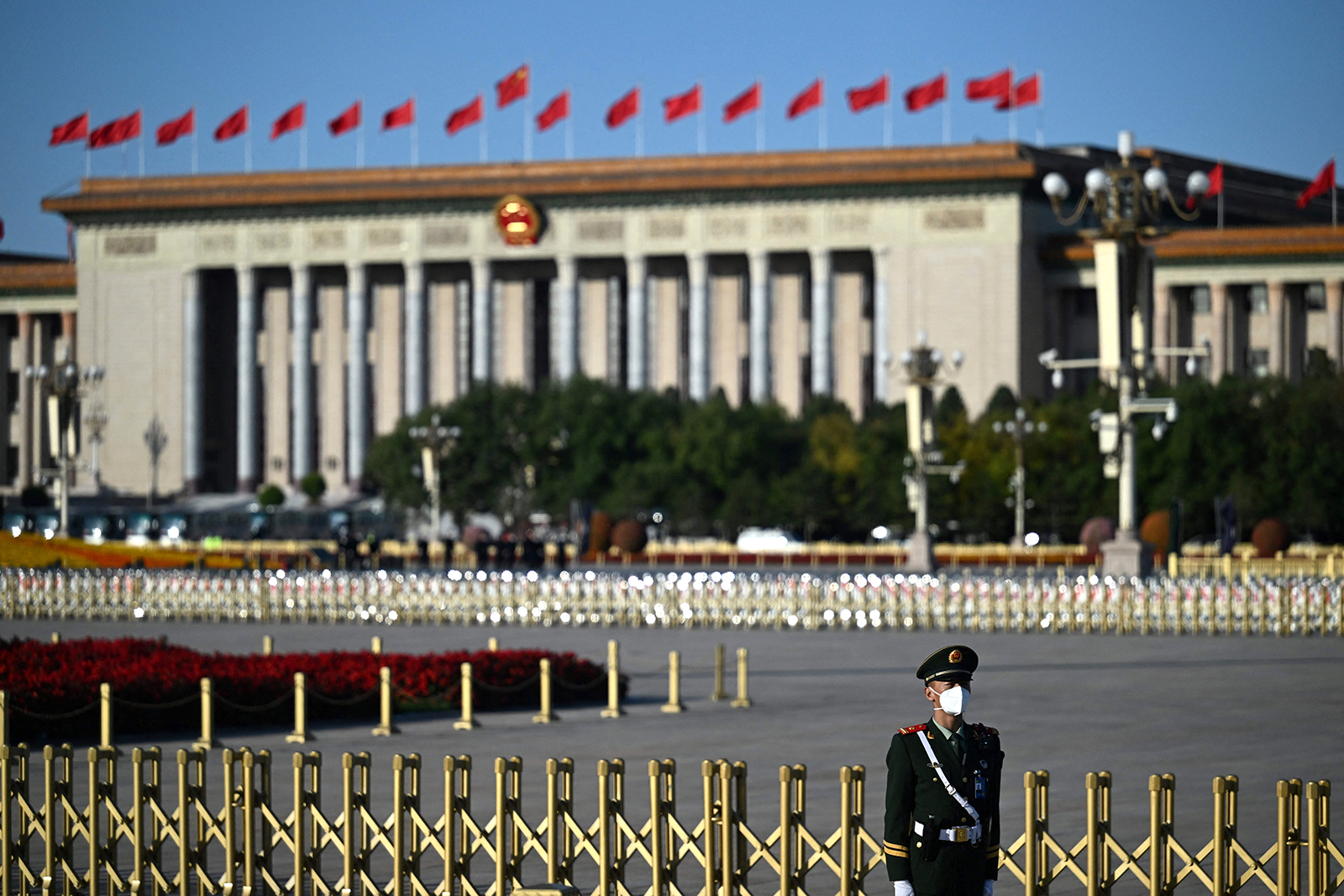 A member of the security staff keeps watch in front of the Great Hall of the People in Beijing on October 16.