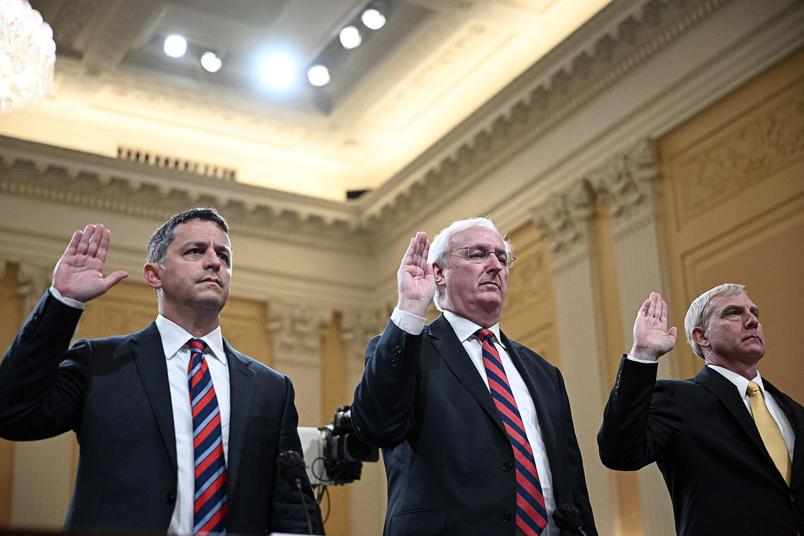 Steven Engel, former assistant general for the office of legal counsel, Jeffrey A. Rosen, former acting attorney general, and Richard Donoghue, former acting deputy attorney general, are sworn in during the fifth hearing on June 23. 