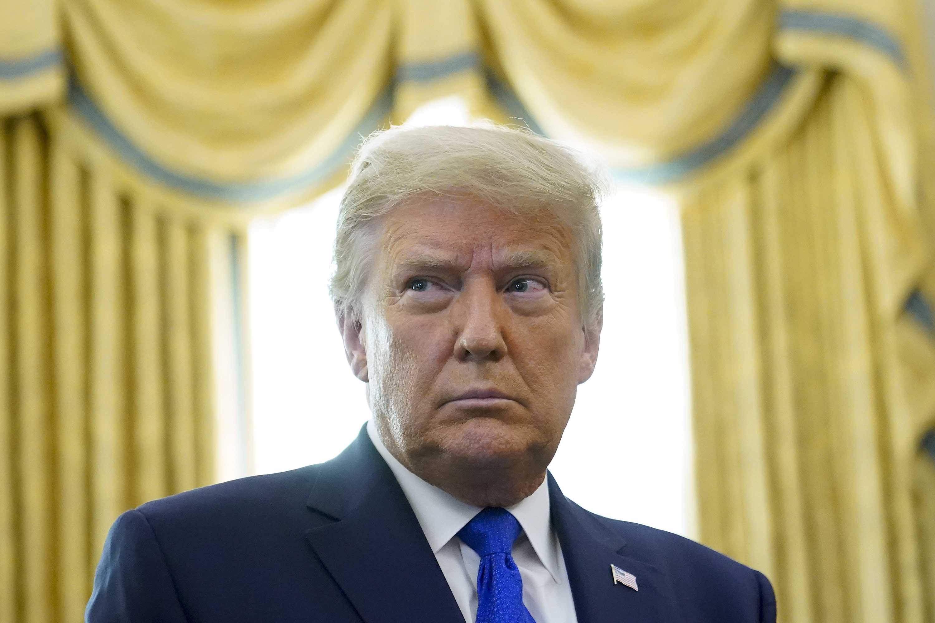 President Donald Trump is pictured in the Oval Office of the White House in Washington, DC, on December 7.