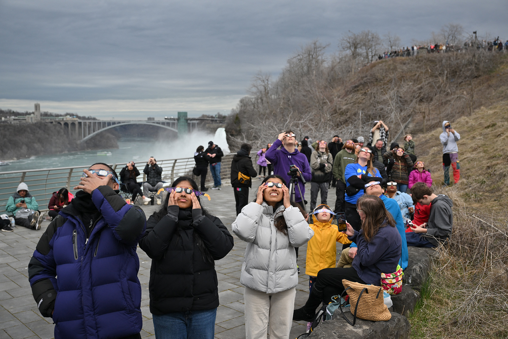 People look up at the sun during the total solar eclipse in Niagara Falls, New York. 