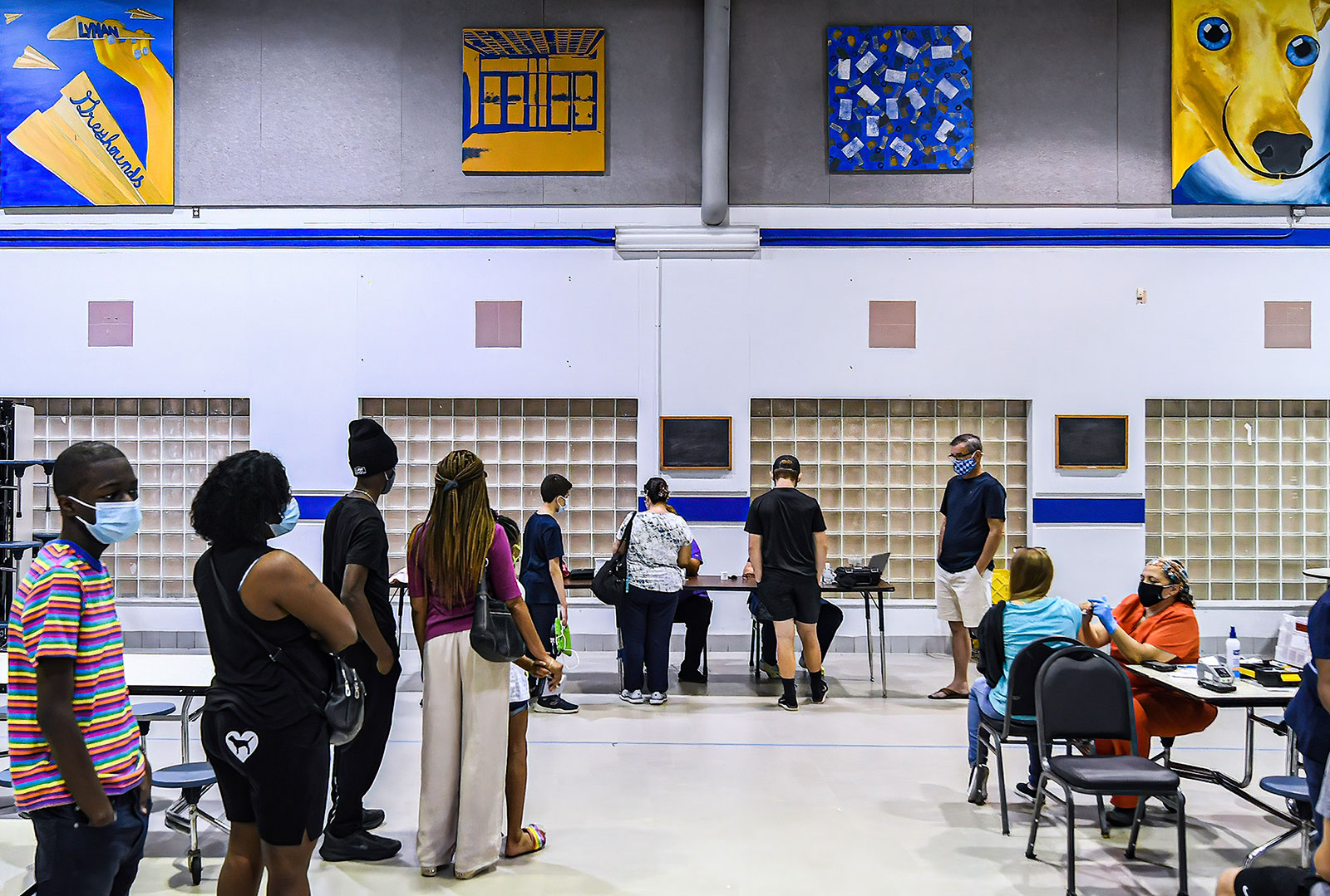 People wait in line at a Covid-19 vaccine clinic at Lyman High School in Longwood, Florida, on August 9.