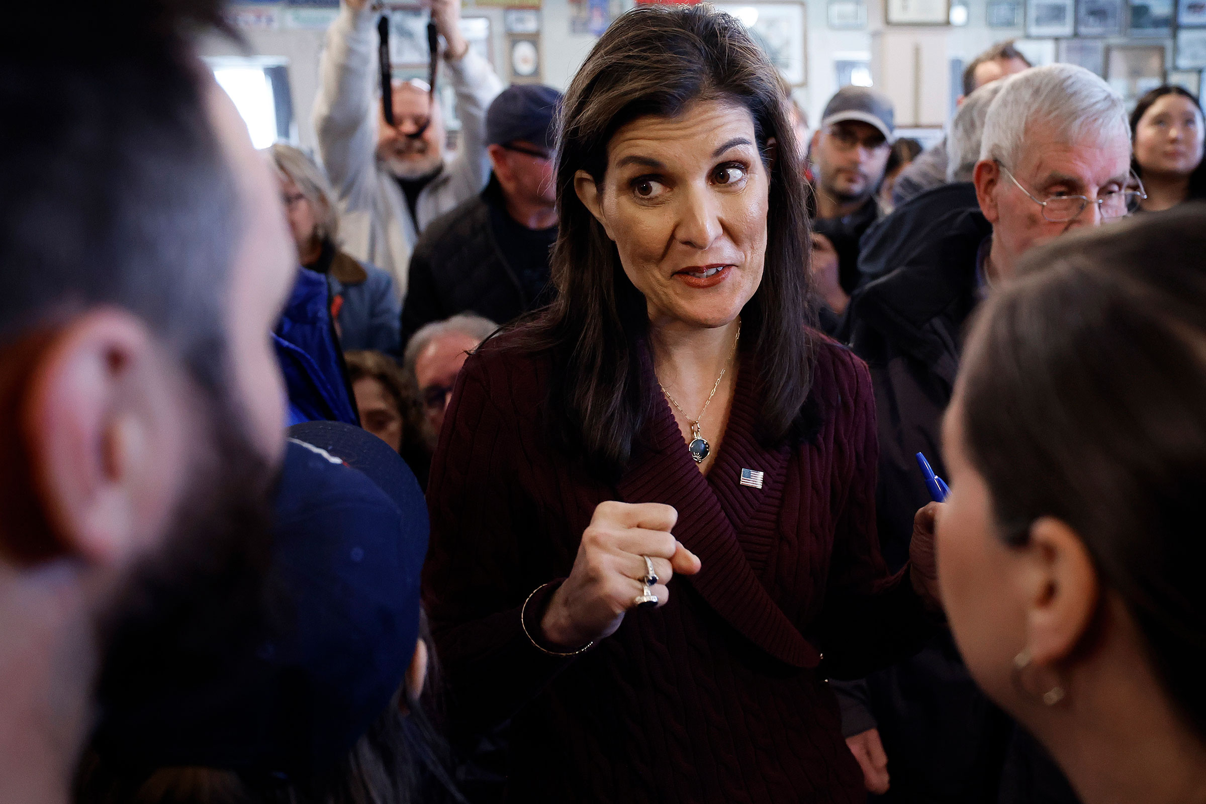 Nikki Haley talks with people at the historic Robie Country Store on January 18, in Hooksett, New Hampshire. 