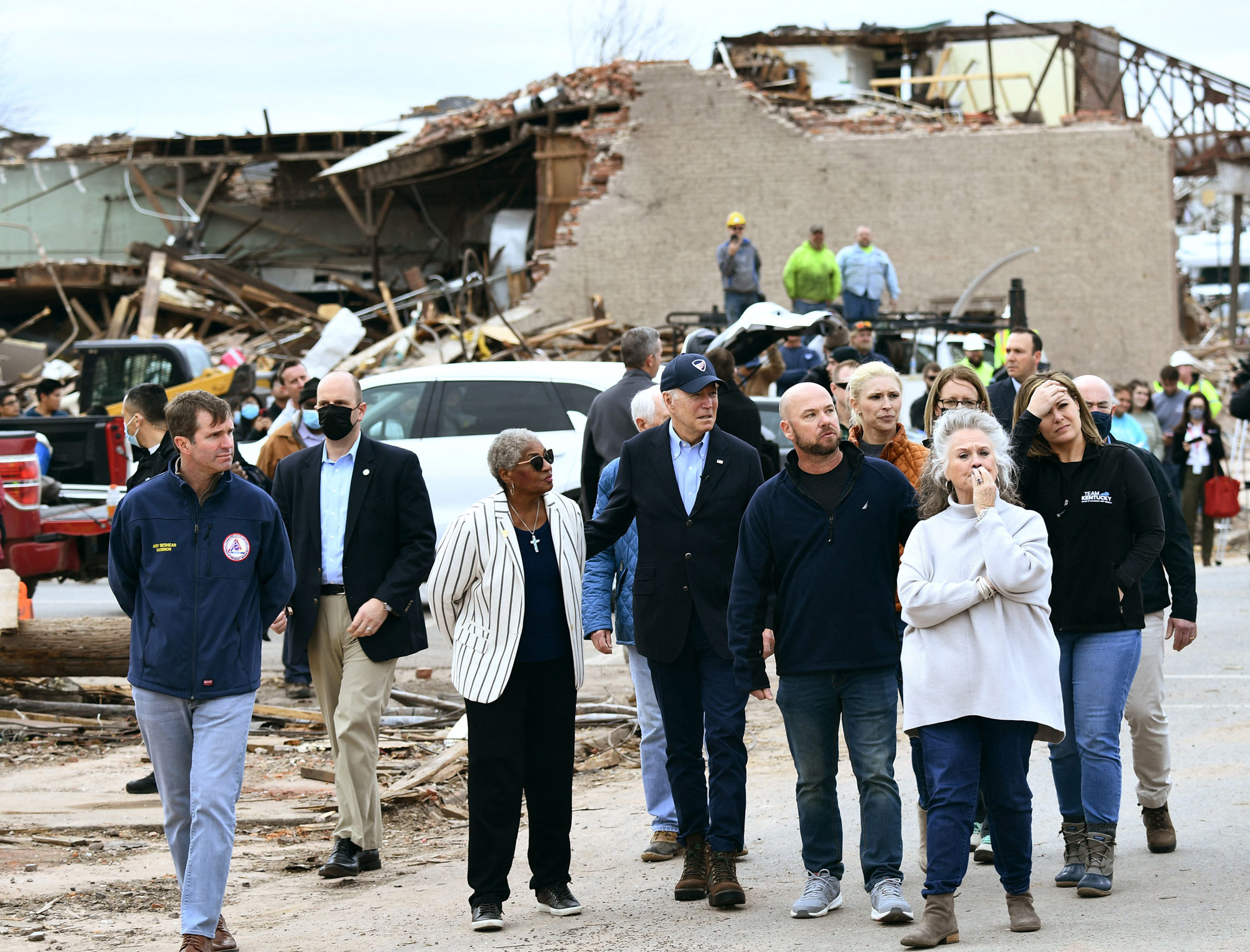 President Joe Biden, center, tours Mayfield, Kentucky, on December 15.