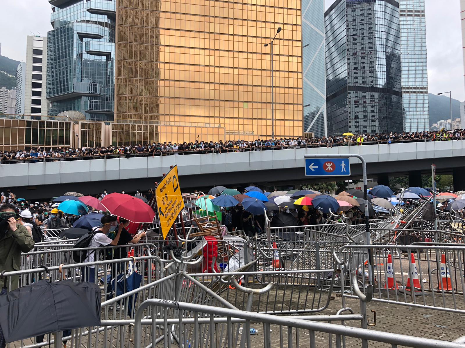 Protesters Dig Up Bricks From The Road